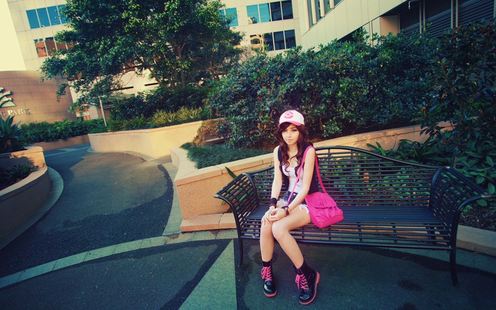 Pokémon trainer cosplay girl sitting on a bench HD Wallpaper