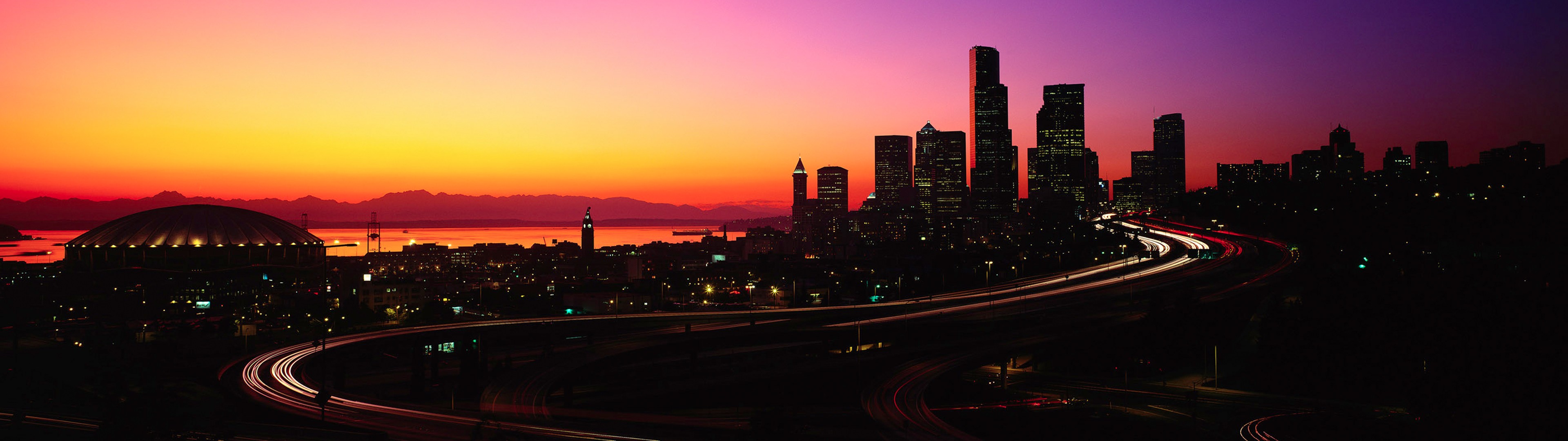 Seattle skyline at sunset with light trails HD Wallpaper