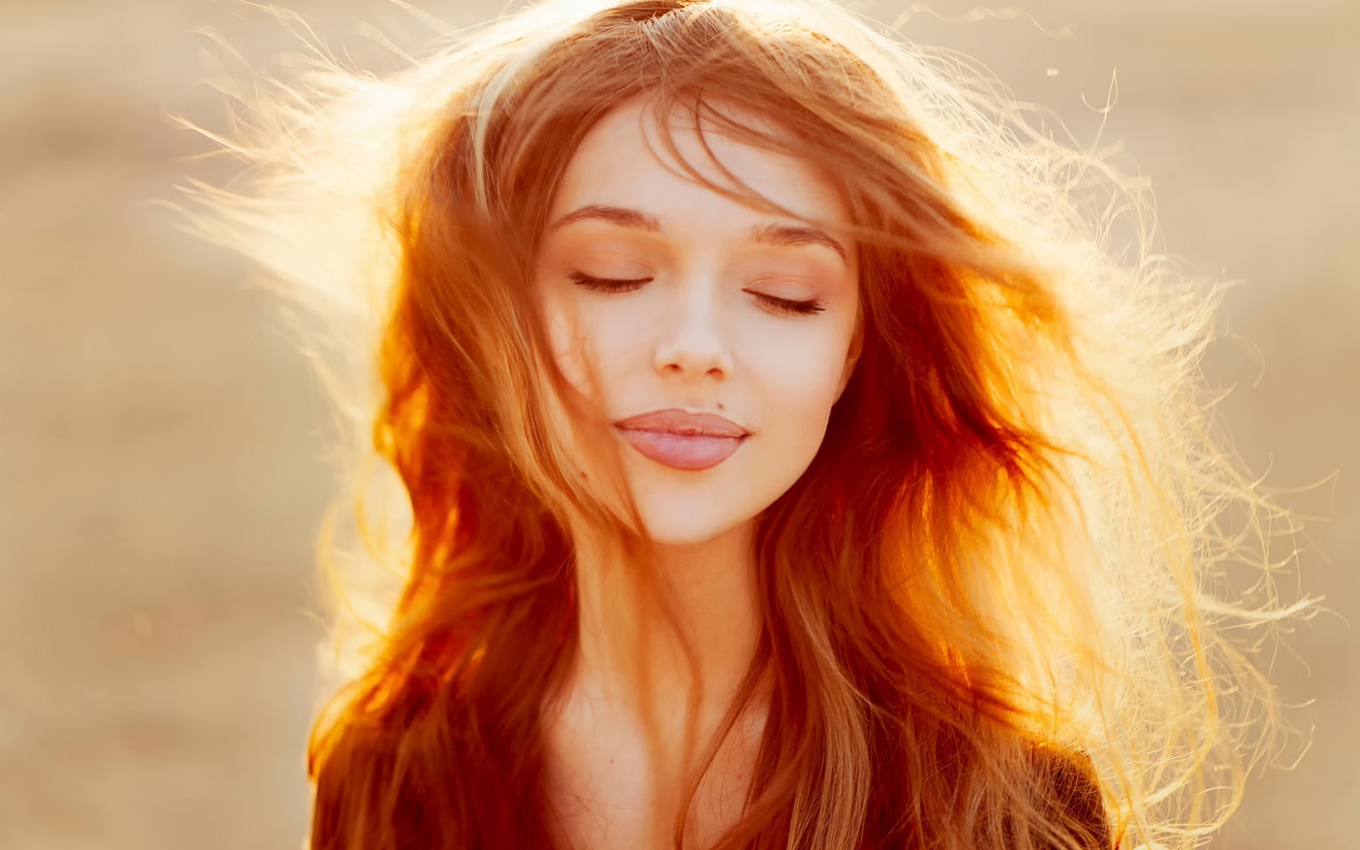 Redhead woman with closed eyes in sunlight HD Wallpaper