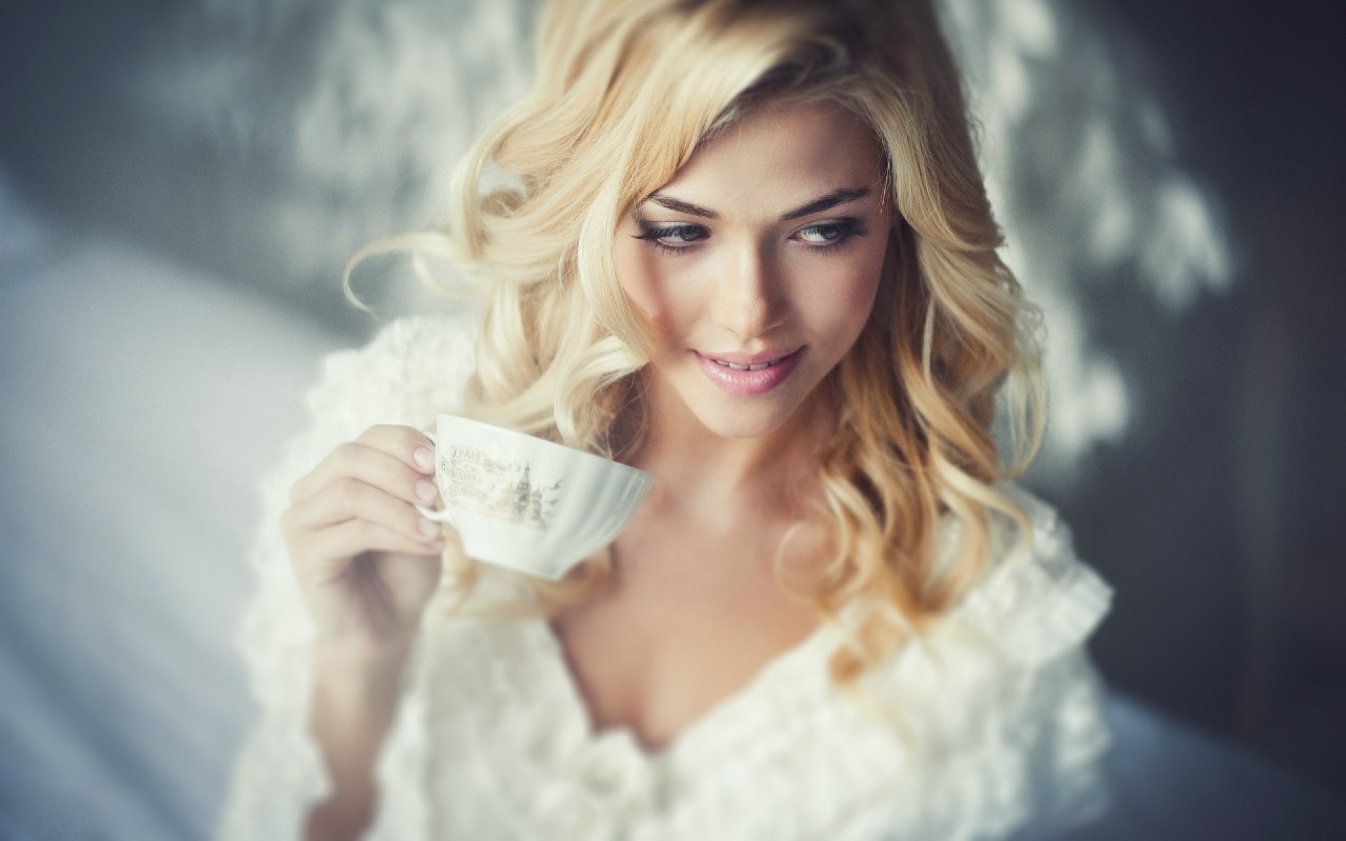 Woman with blonde hair holding a teacup HD Wallpaper
