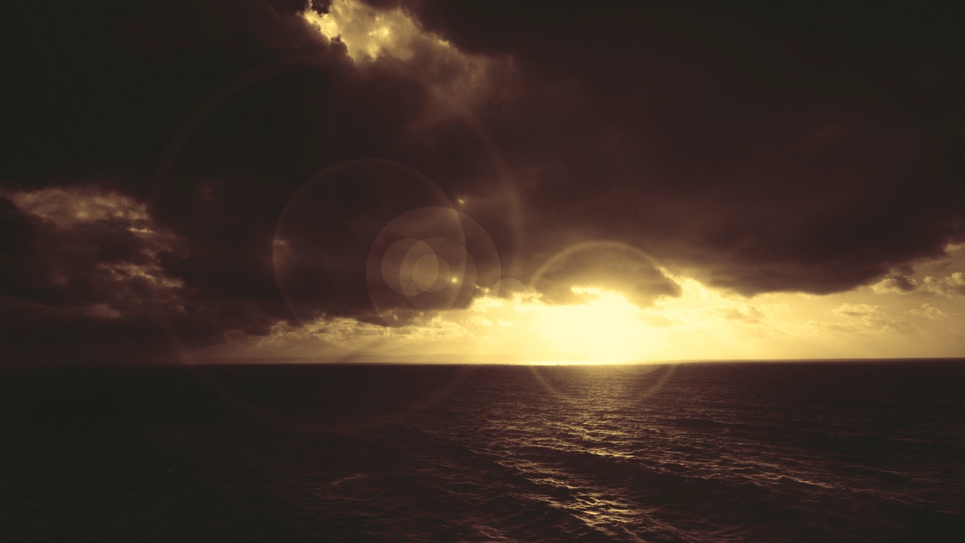 Sunset over the sea with lens flare HD Wallpaper