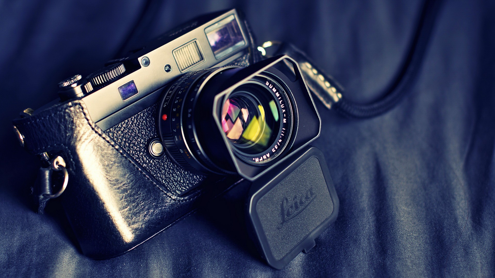 Leica camera with lens and leather case HD Wallpaper