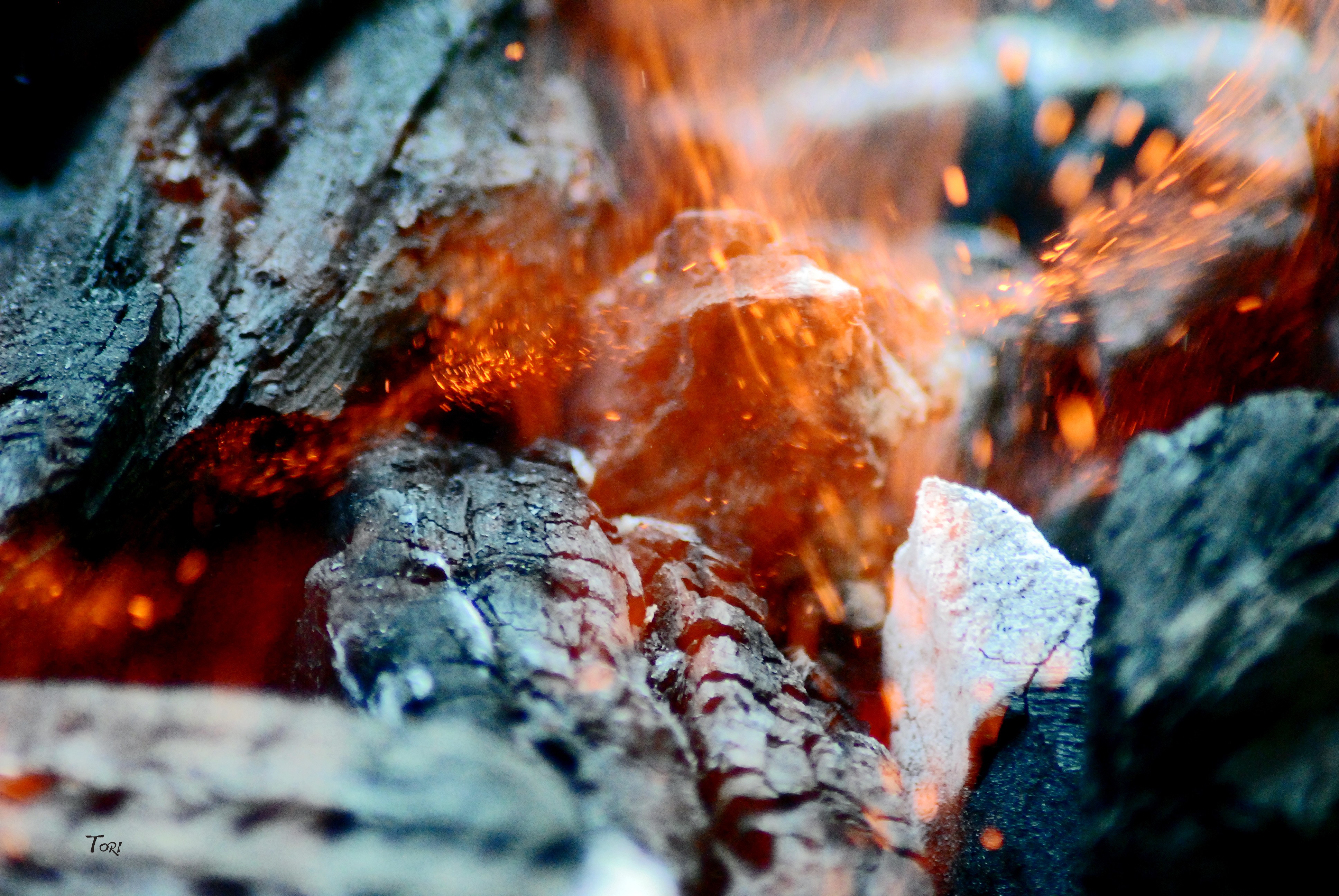 Close-up of burning embers and sparks HD Wallpaper