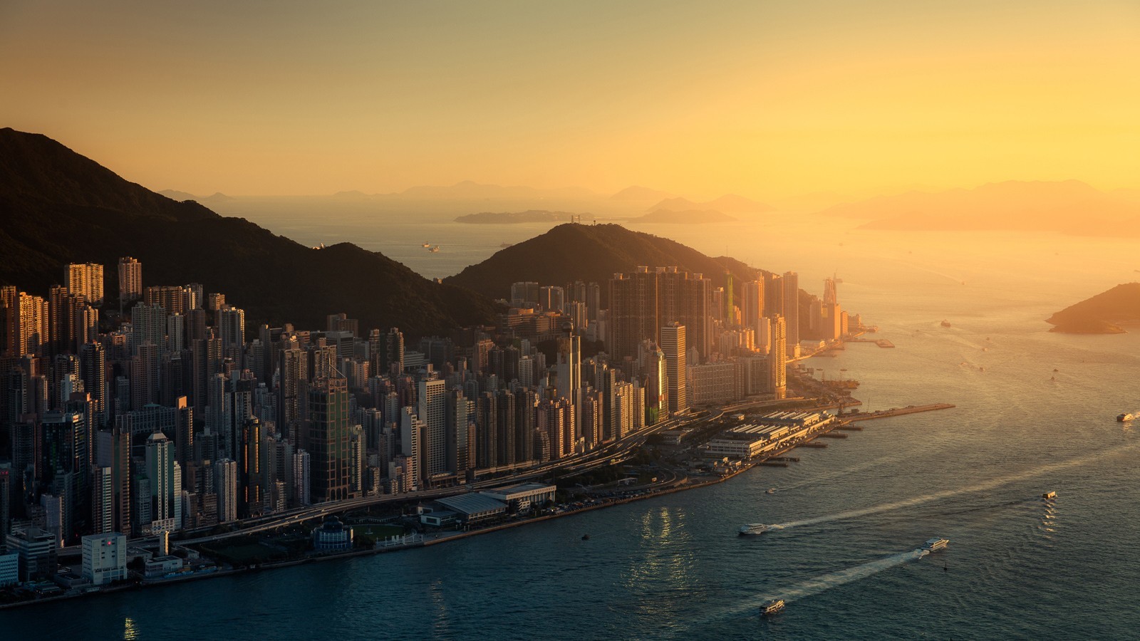 Hong Kong cityscape at sunset with mountains and sea HD Wallpaper