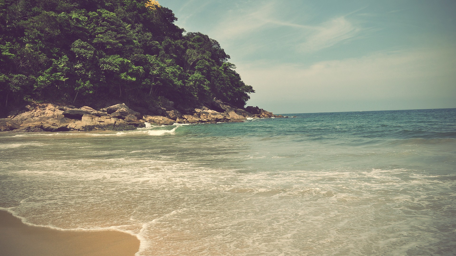 Waves crashing on a rocky island beach HD Wallpaper