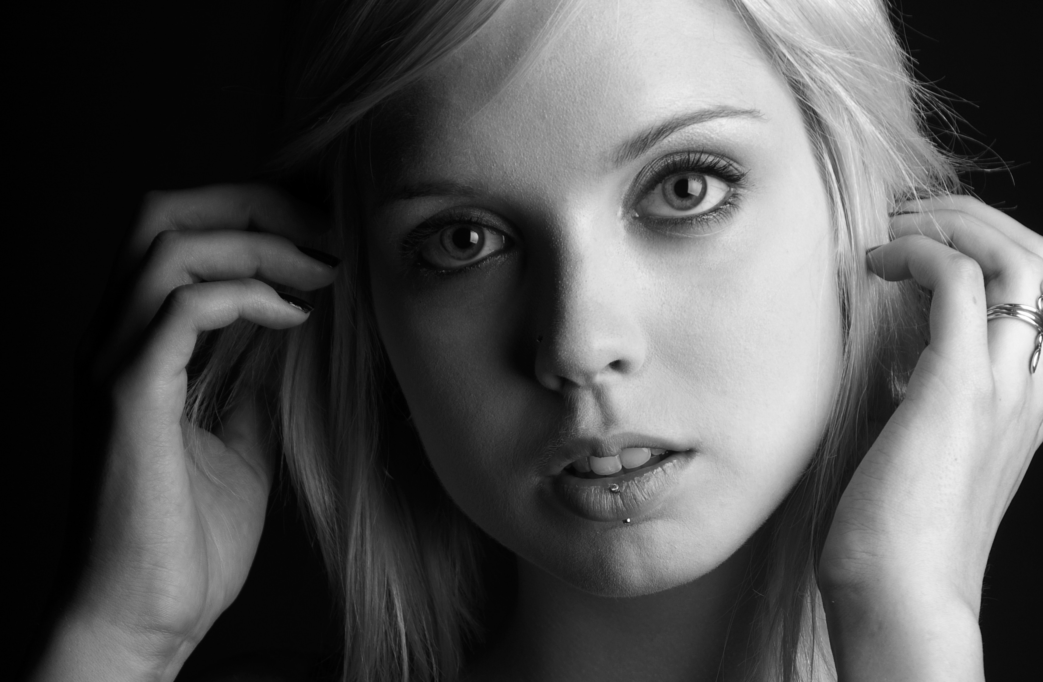 Monochrome portrait of a blonde woman with piercing HD Wallpaper
