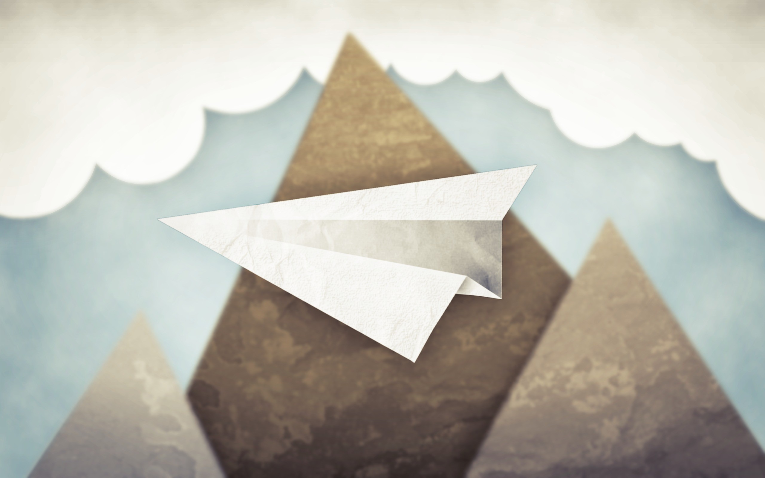 Paper airplane flying over mountains and clouds HD Wallpaper