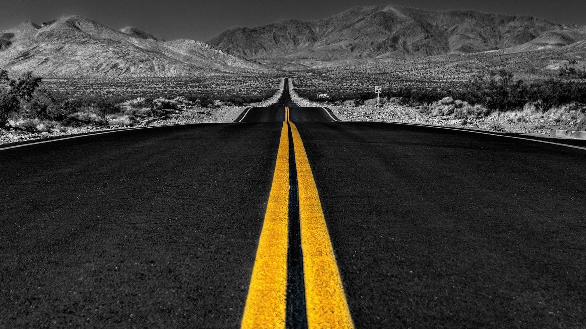 Desert road with mountains and selective coloring HD Wallpaper