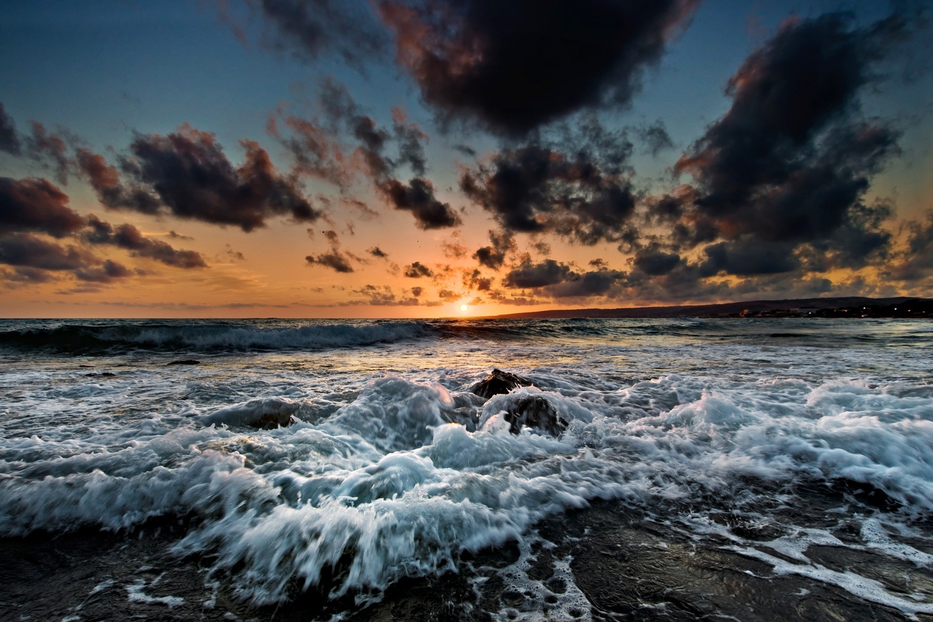 Sunset over the sea with crashing waves HD Wallpaper