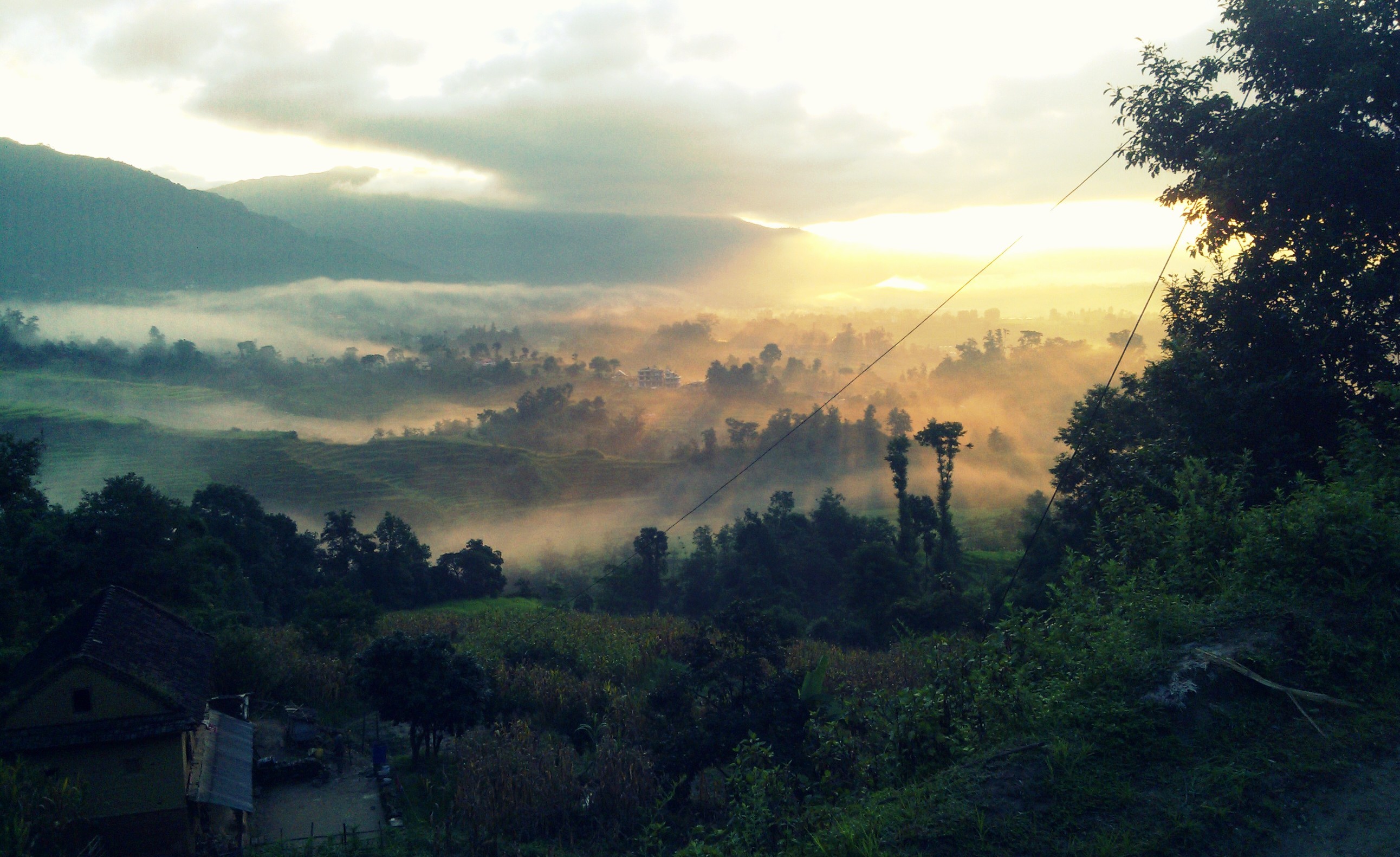 Misty valley in Nepal at sunrise HD Wallpaper