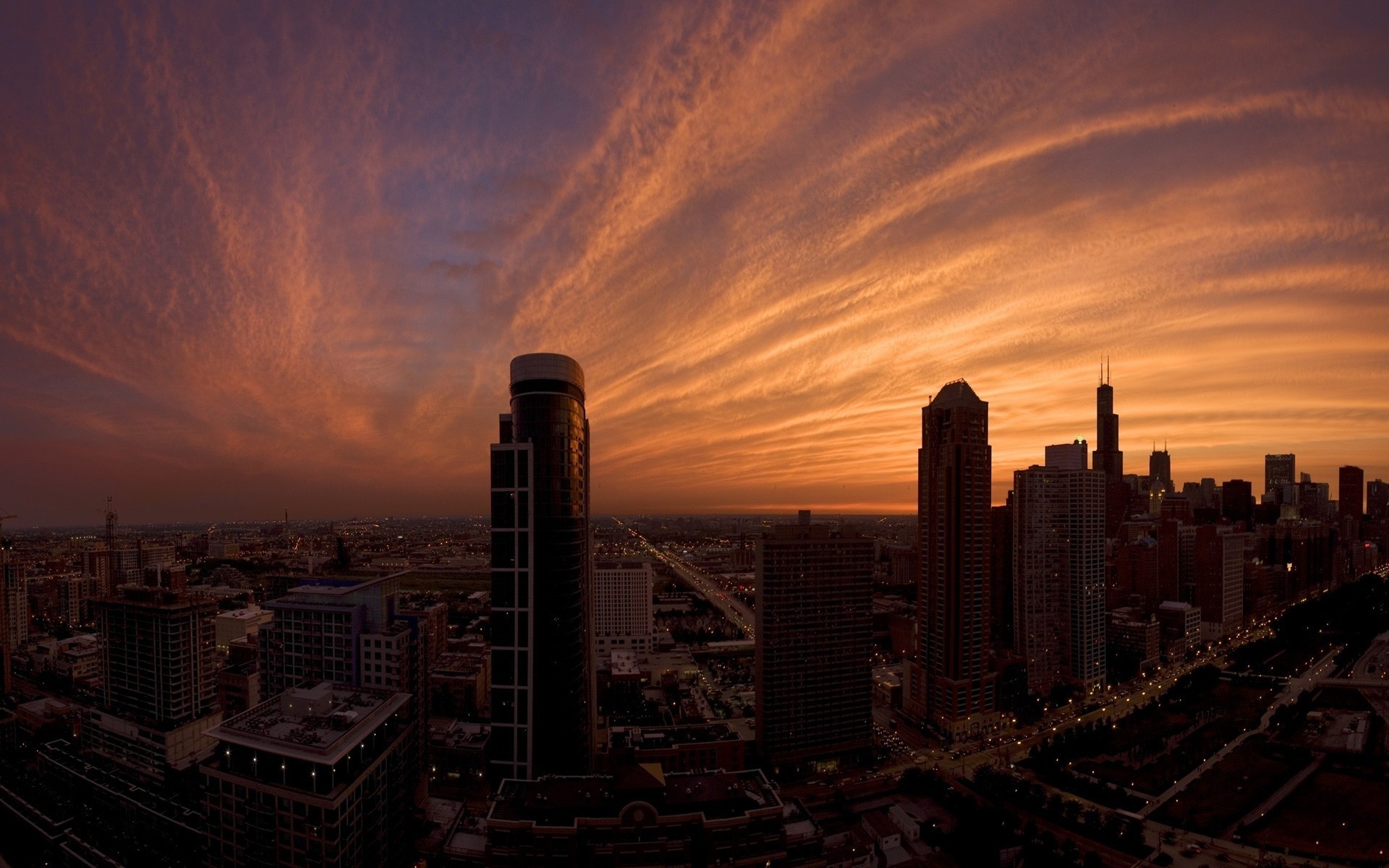 Chicago cityscape at sunset with dramatic clouds HD Wallpaper