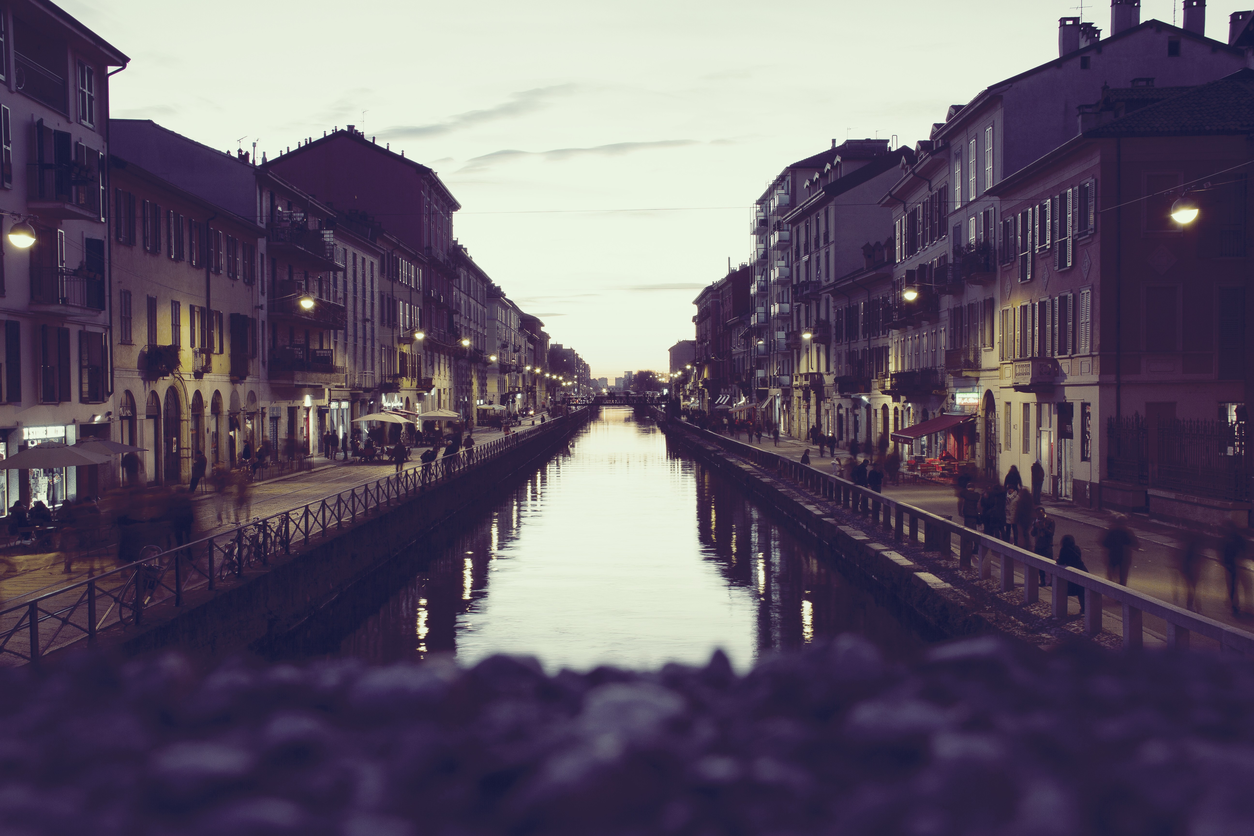 Cityscape at dusk with a canal and buildings HD Wallpaper