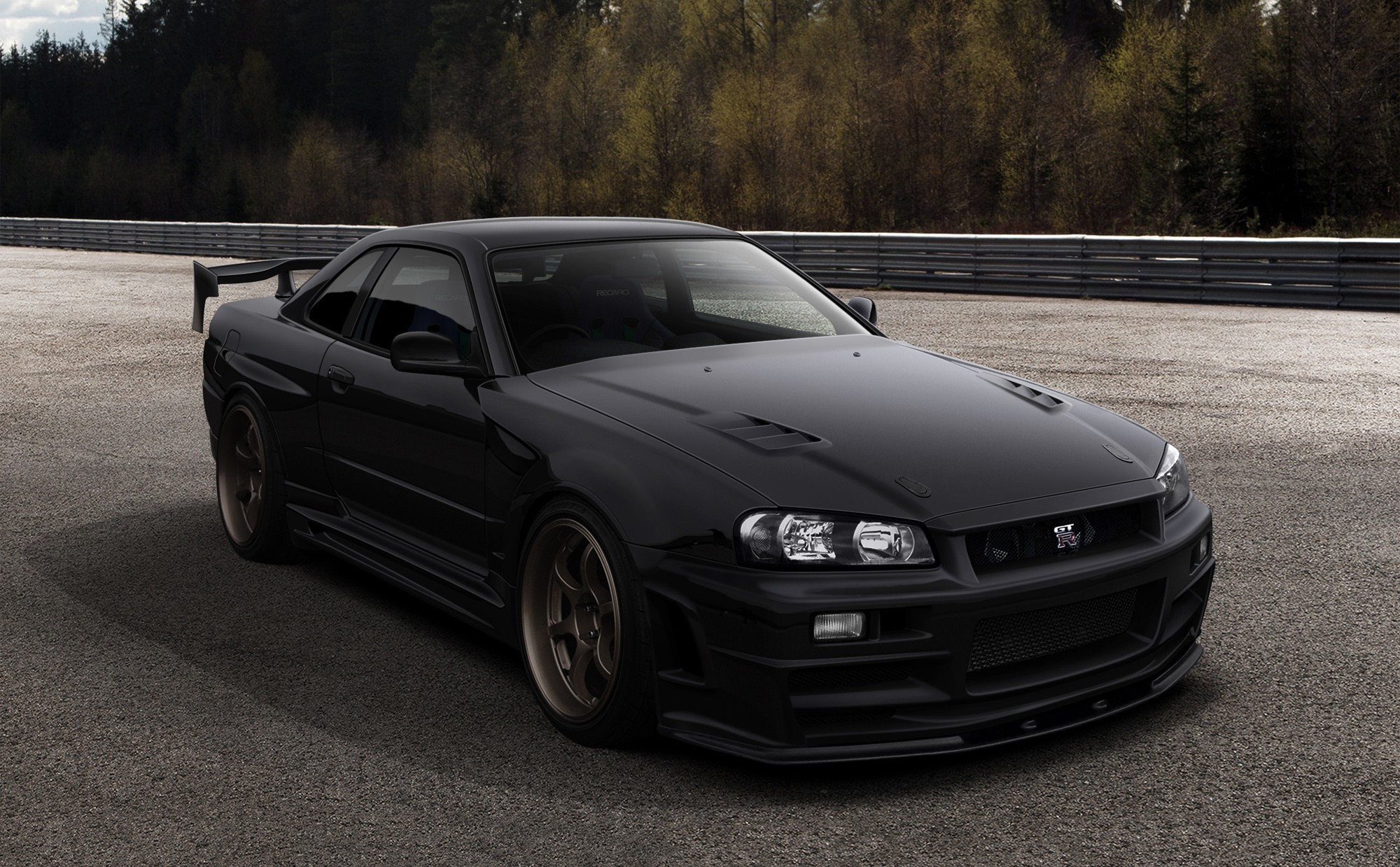 Black Nissan Skyline GT-R on a Racetrack HD Wallpaper
