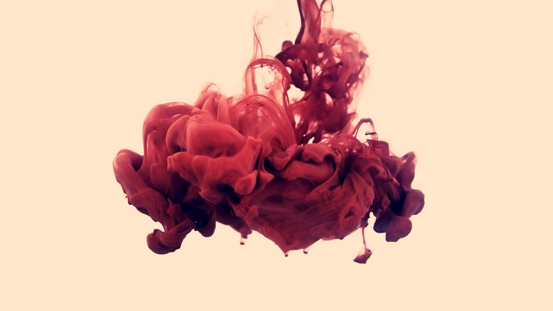 Red ink dissolving in water, abstract art HD Wallpaper