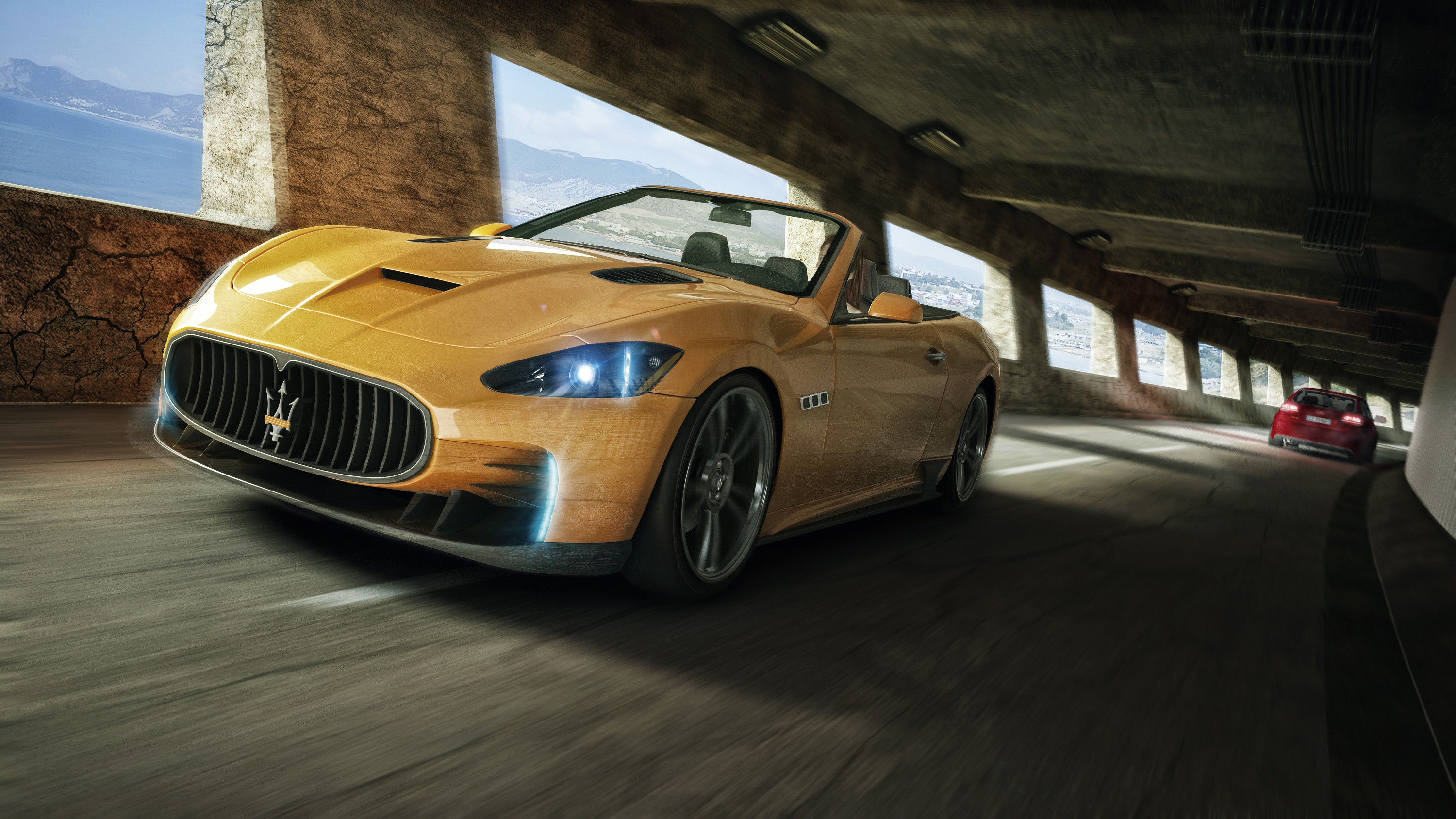 Yellow Maserati convertible driving through a tunnel HD Wallpaper