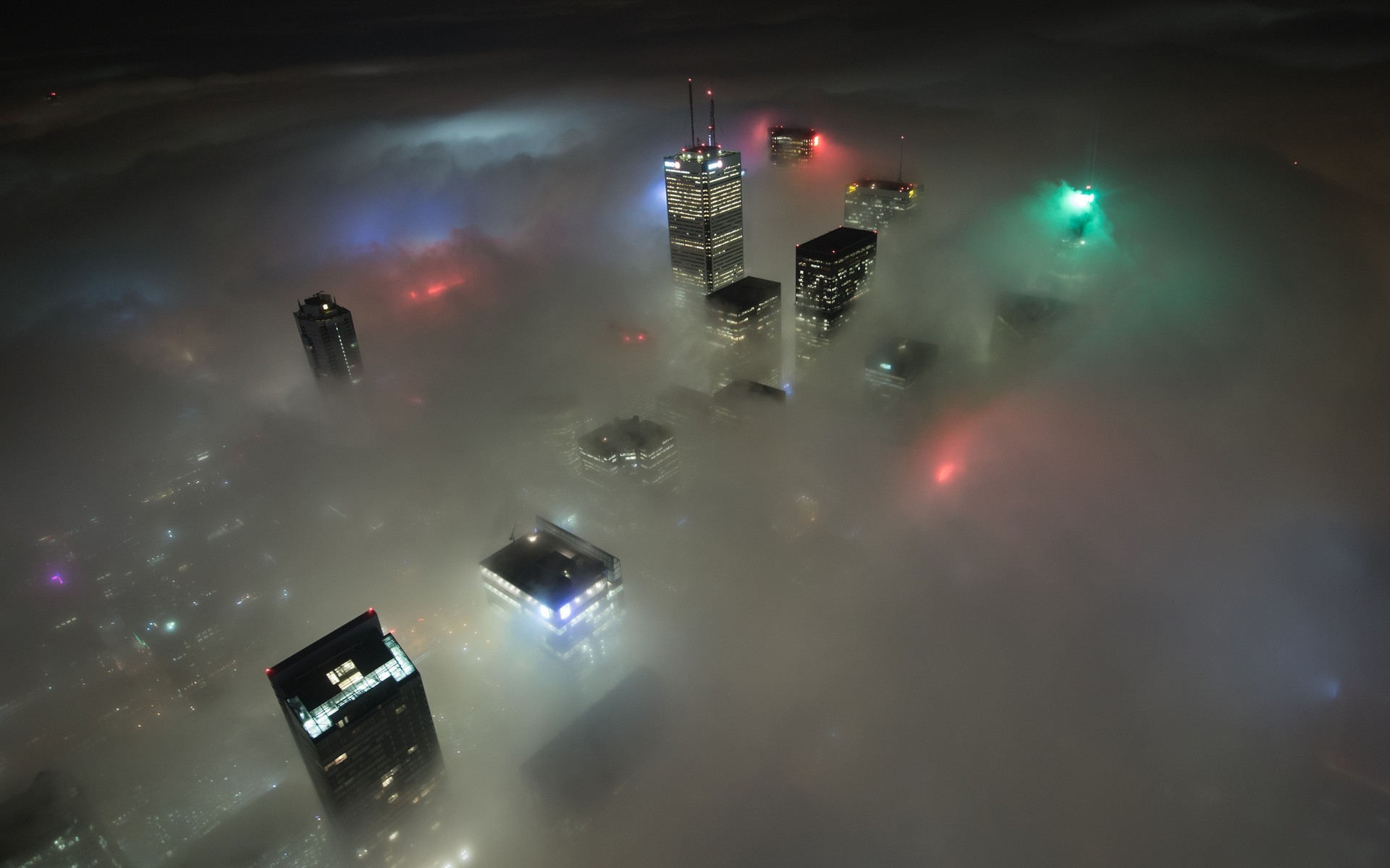 Toronto skyline shrouded in fog at night HD Wallpaper
