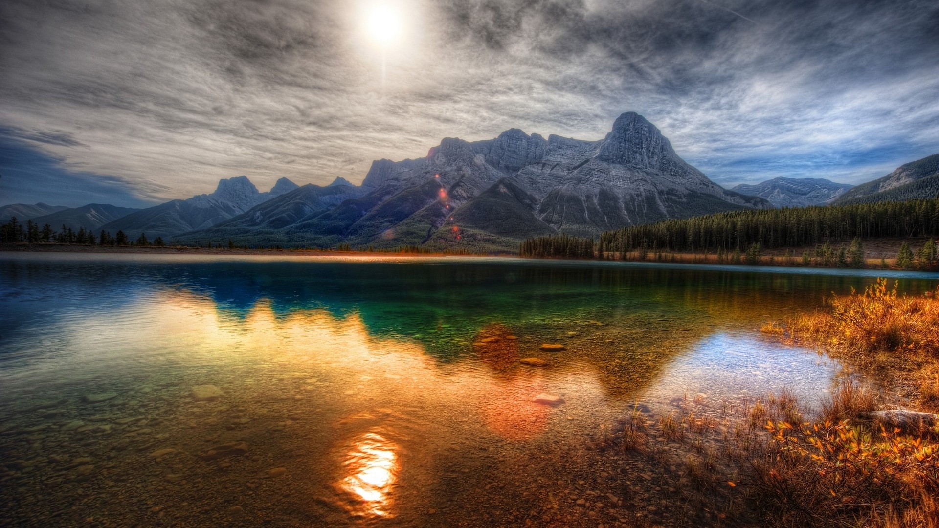 HDR landscape of mountains reflecting in a lake at sunset HD Wallpaper