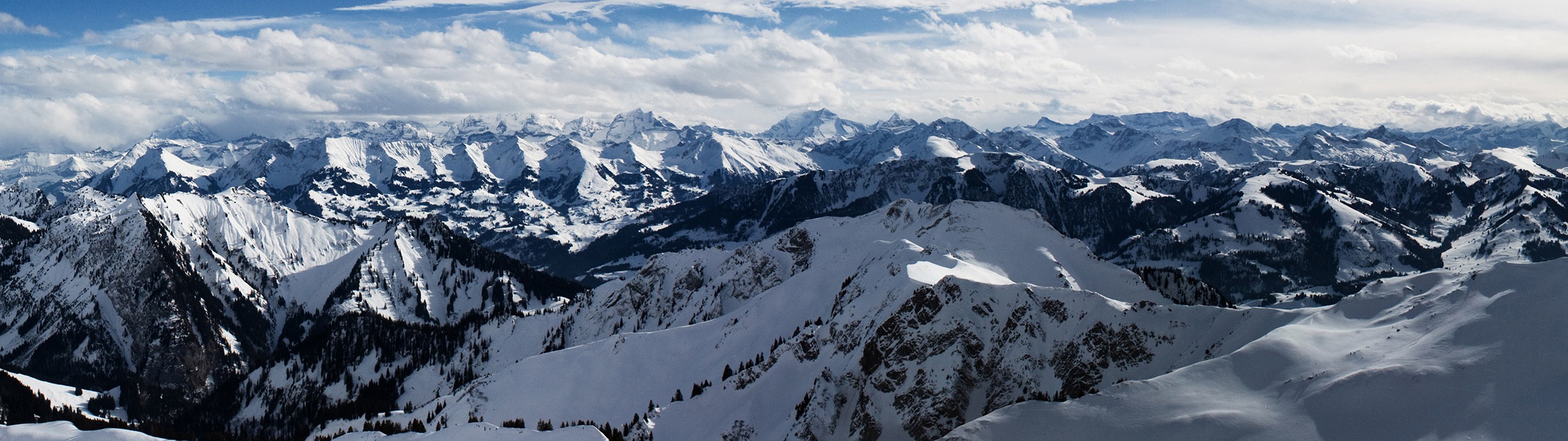 Panoramic view of snow-covered Alps mountains HD Wallpaper