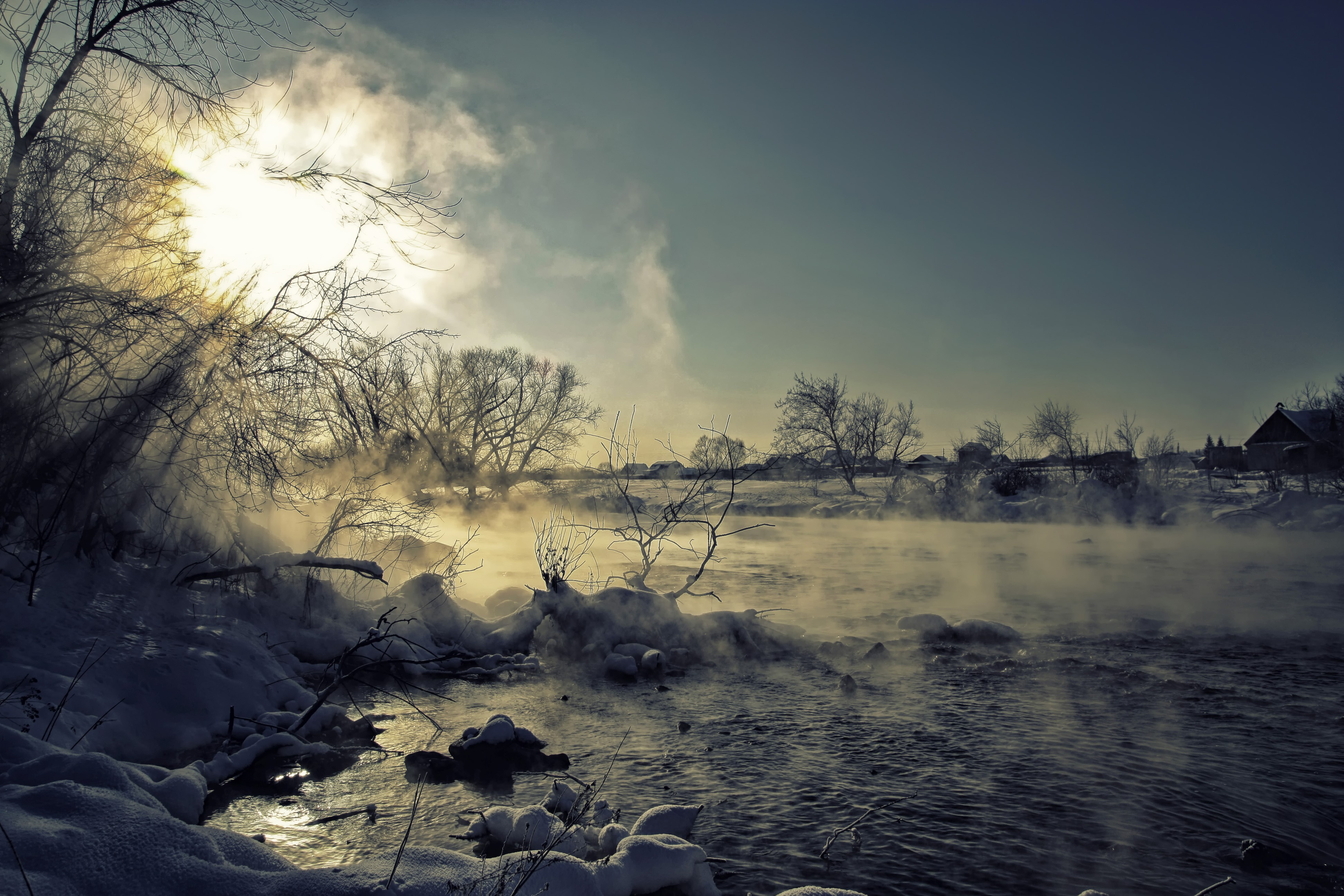Winter landscape with sun and steam over a river HD Wallpaper