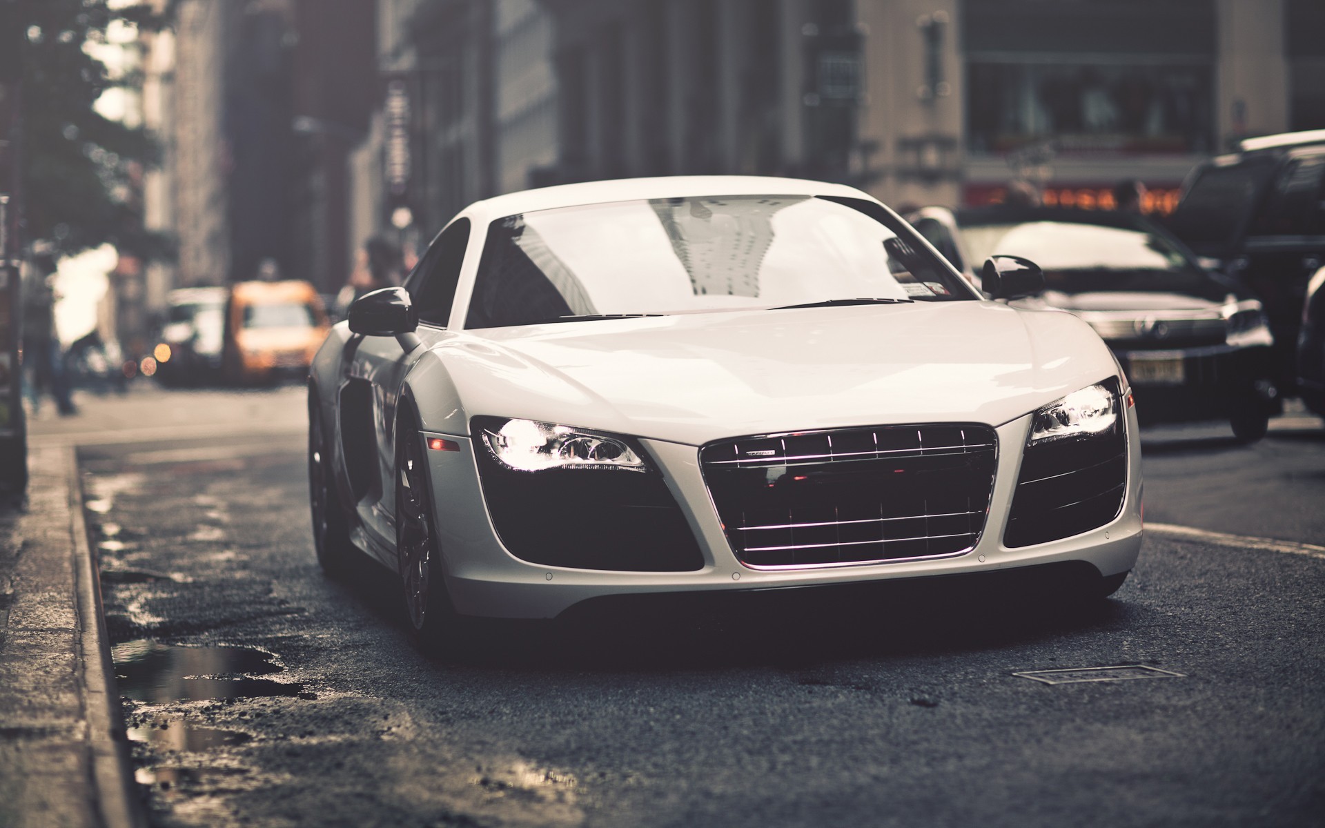 White Audi R8 driving on a wet city street HD Wallpaper