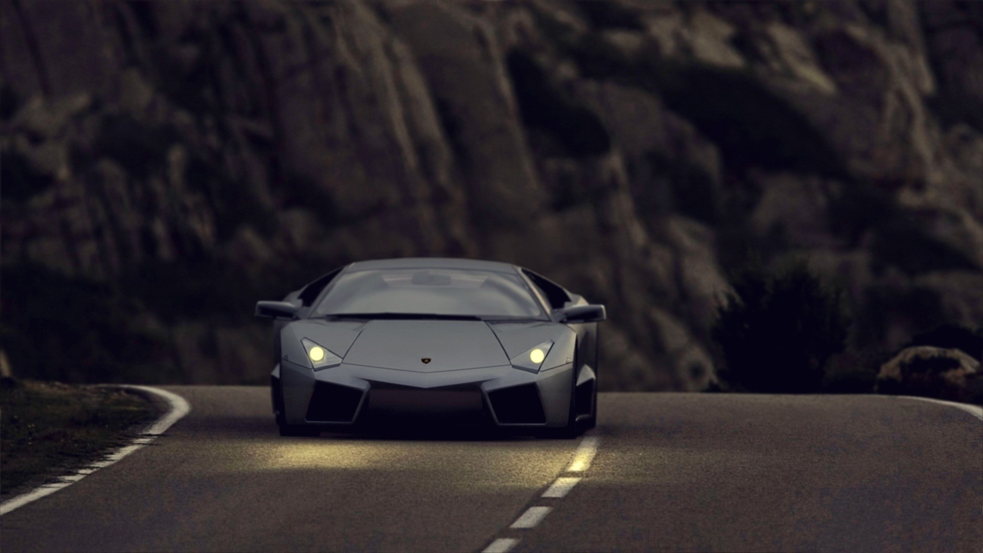 Lamborghini Reventon driving on a mountain road HD Wallpaper