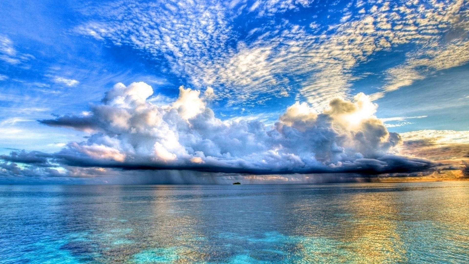 Island on the horizon under dramatic clouds and sea HD Wallpaper