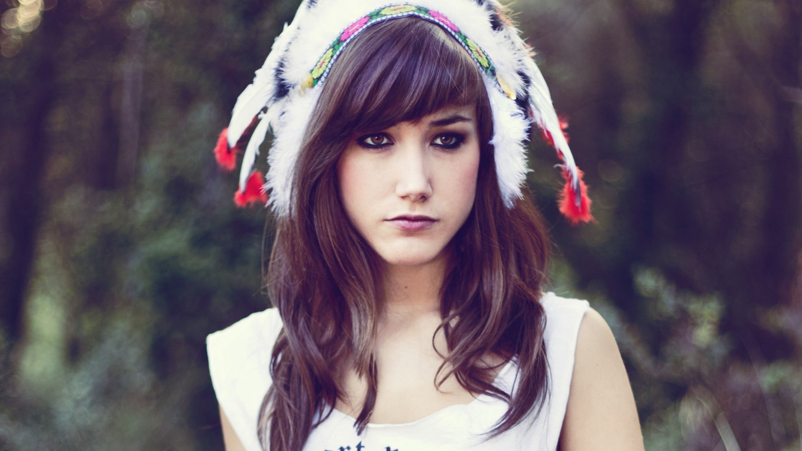 Woman wearing a feathered headdress HD Wallpaper