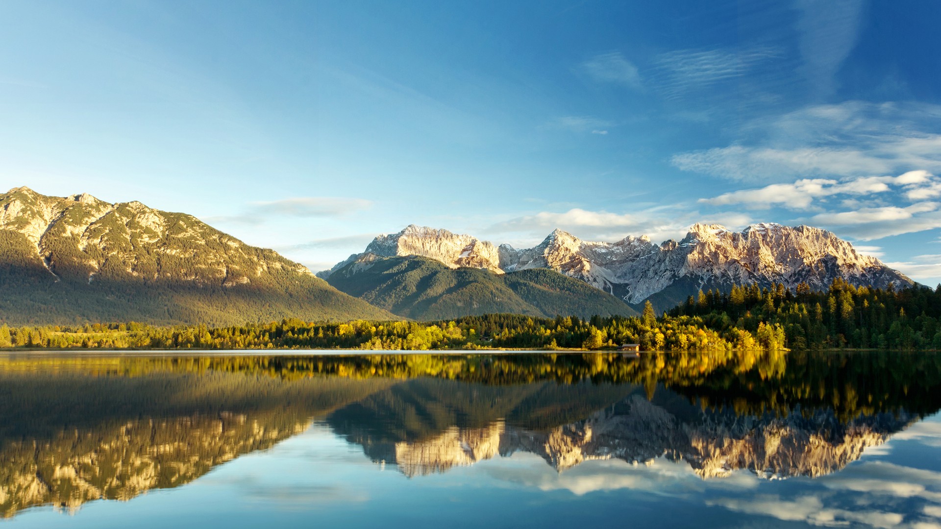 Lake and mountains reflecting in the water under a blue sky HD Wallpaper