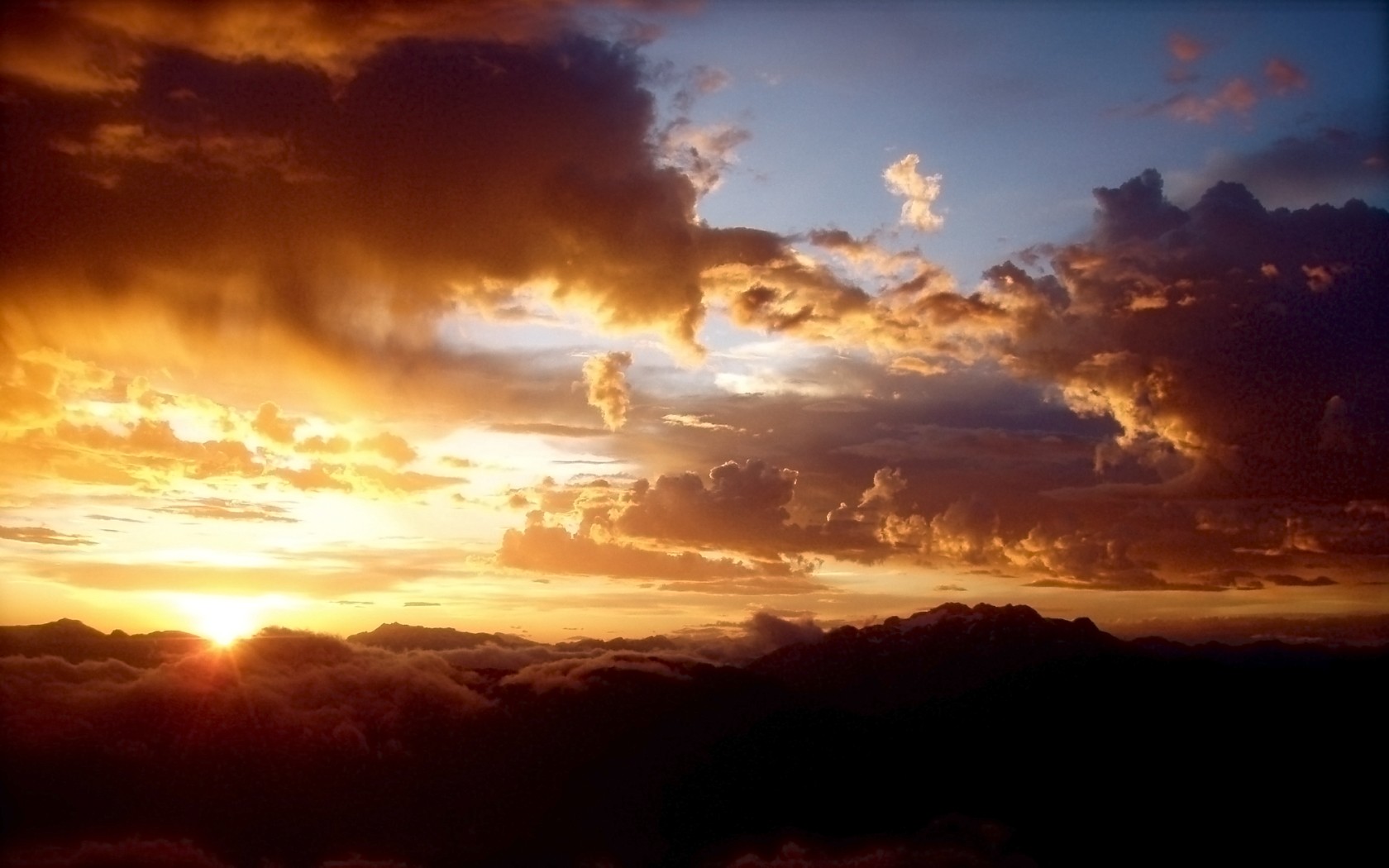 Sunset over clouds and mountains HD Wallpaper