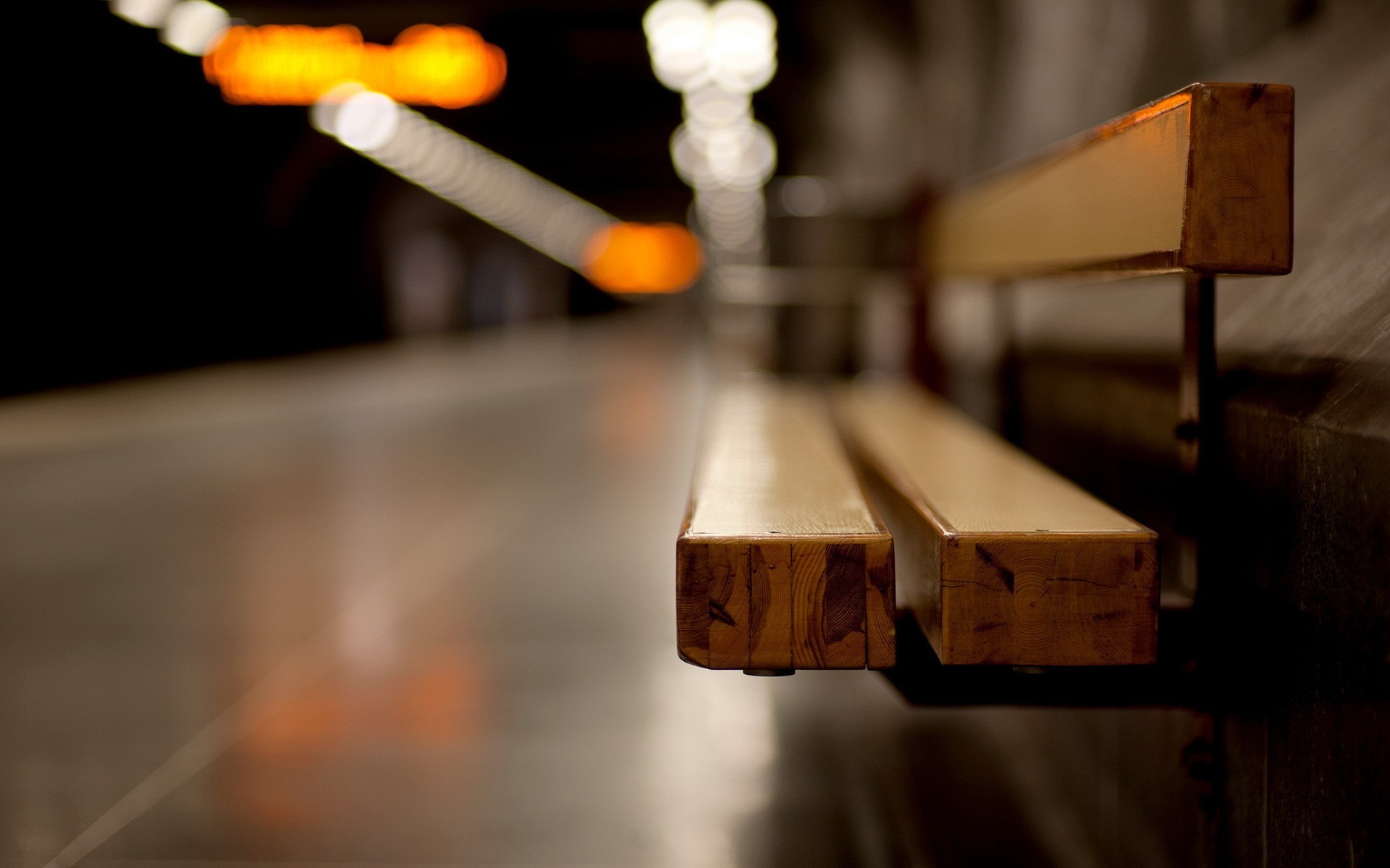 Empty wooden bench at a railway station platform HD Wallpaper