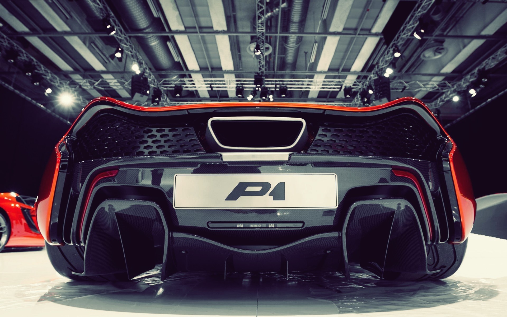 Rear view of a McLaren P1 supercar HD Wallpaper