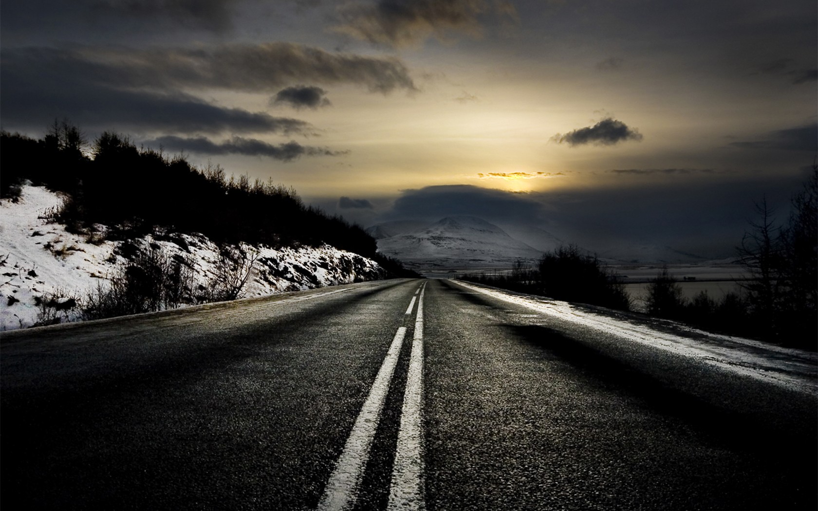 Winter road at sunset with snow and clouds HD Wallpaper