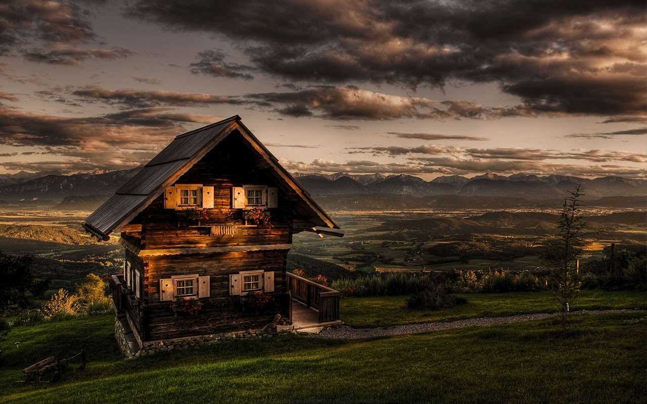 Wooden house on a hill overlooking a valley and mountains HD Wallpaper