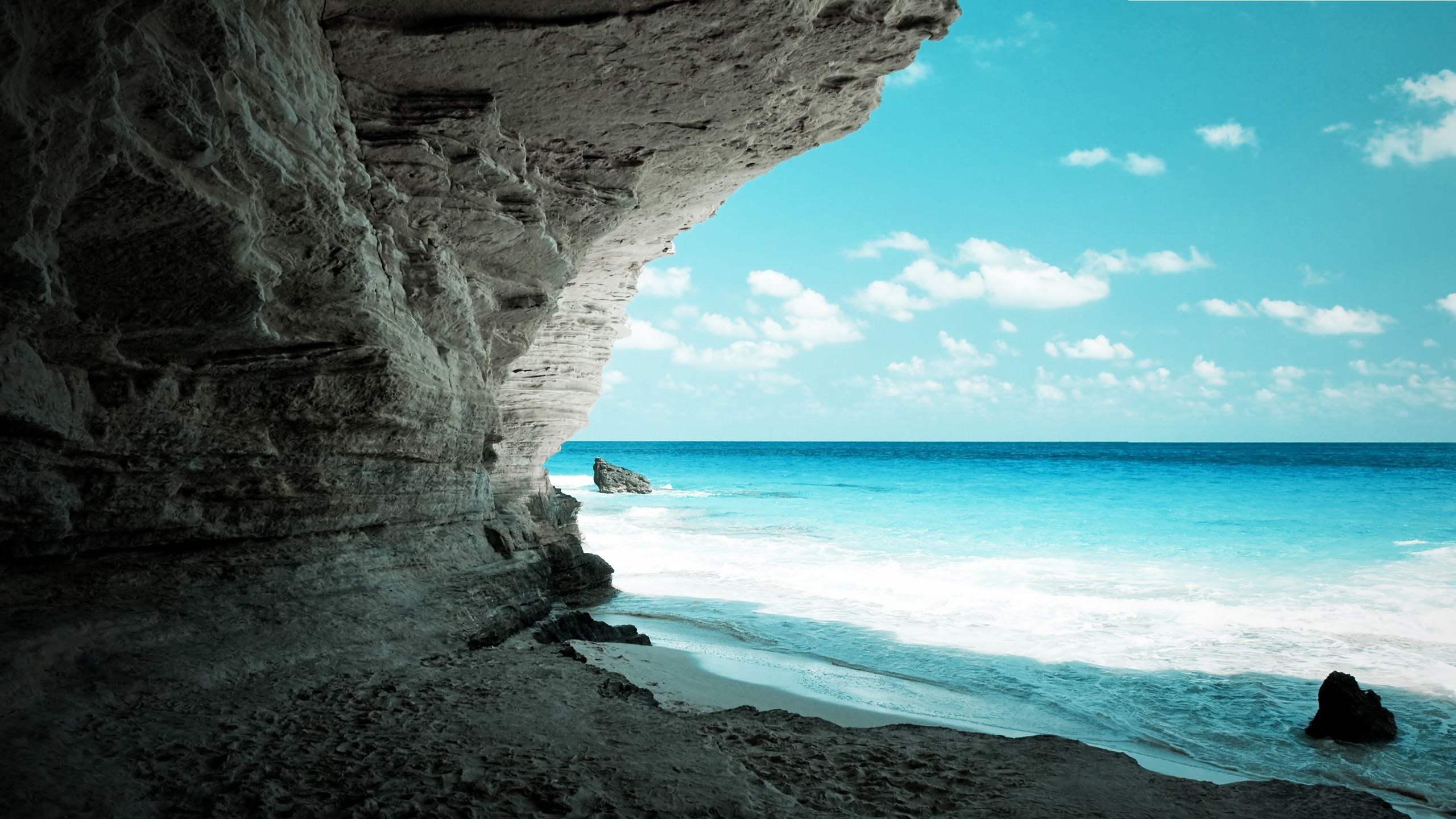 Cave overlooking a tropical beach and ocean HD Wallpaper