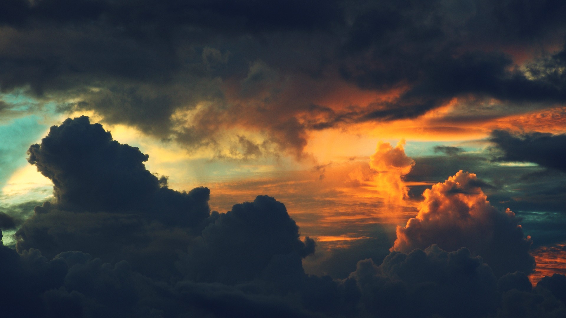 Dramatic sunset clouds with orange and dark tones HD Wallpaper