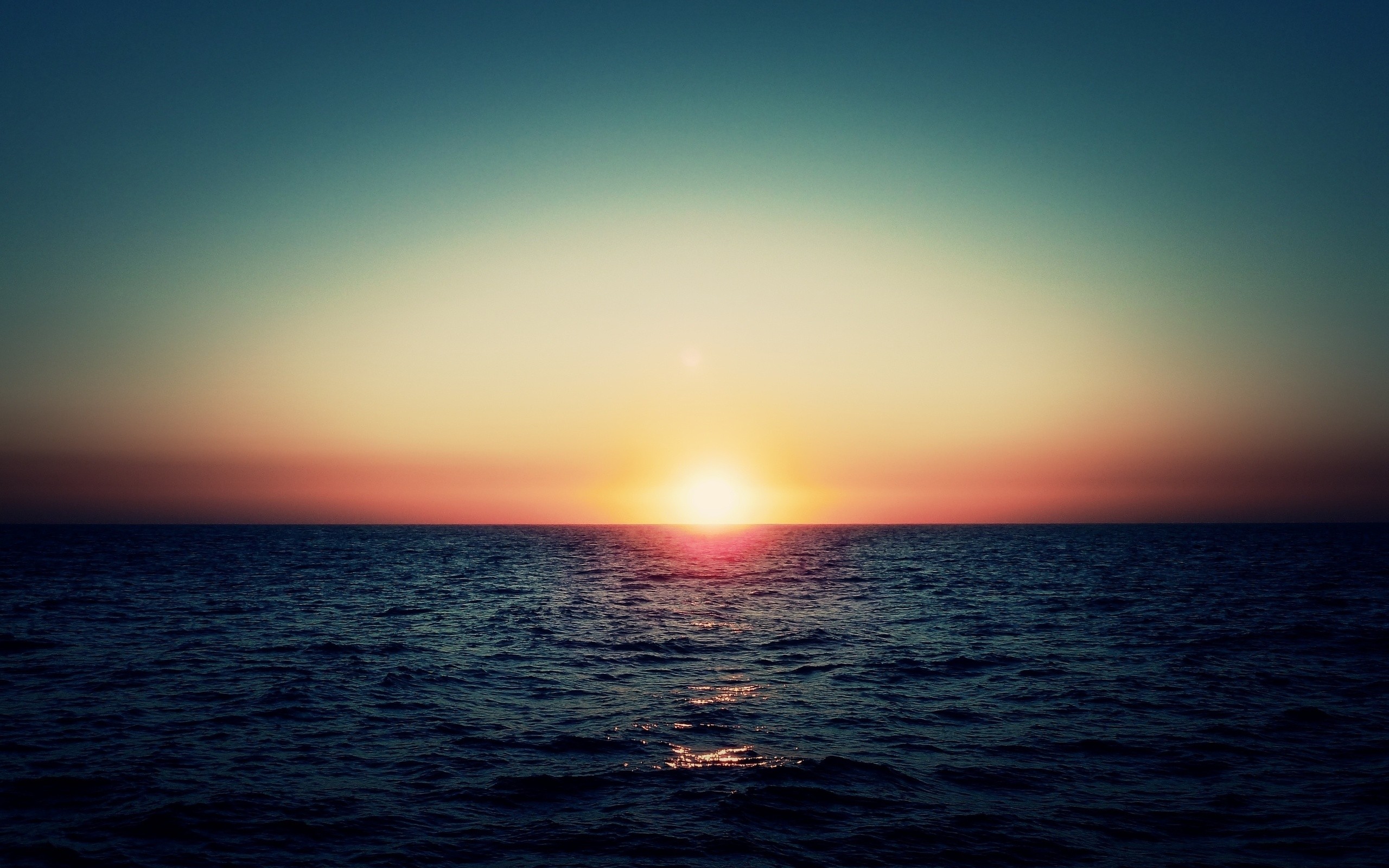 Sunset over the ocean with colorful sky HD Wallpaper