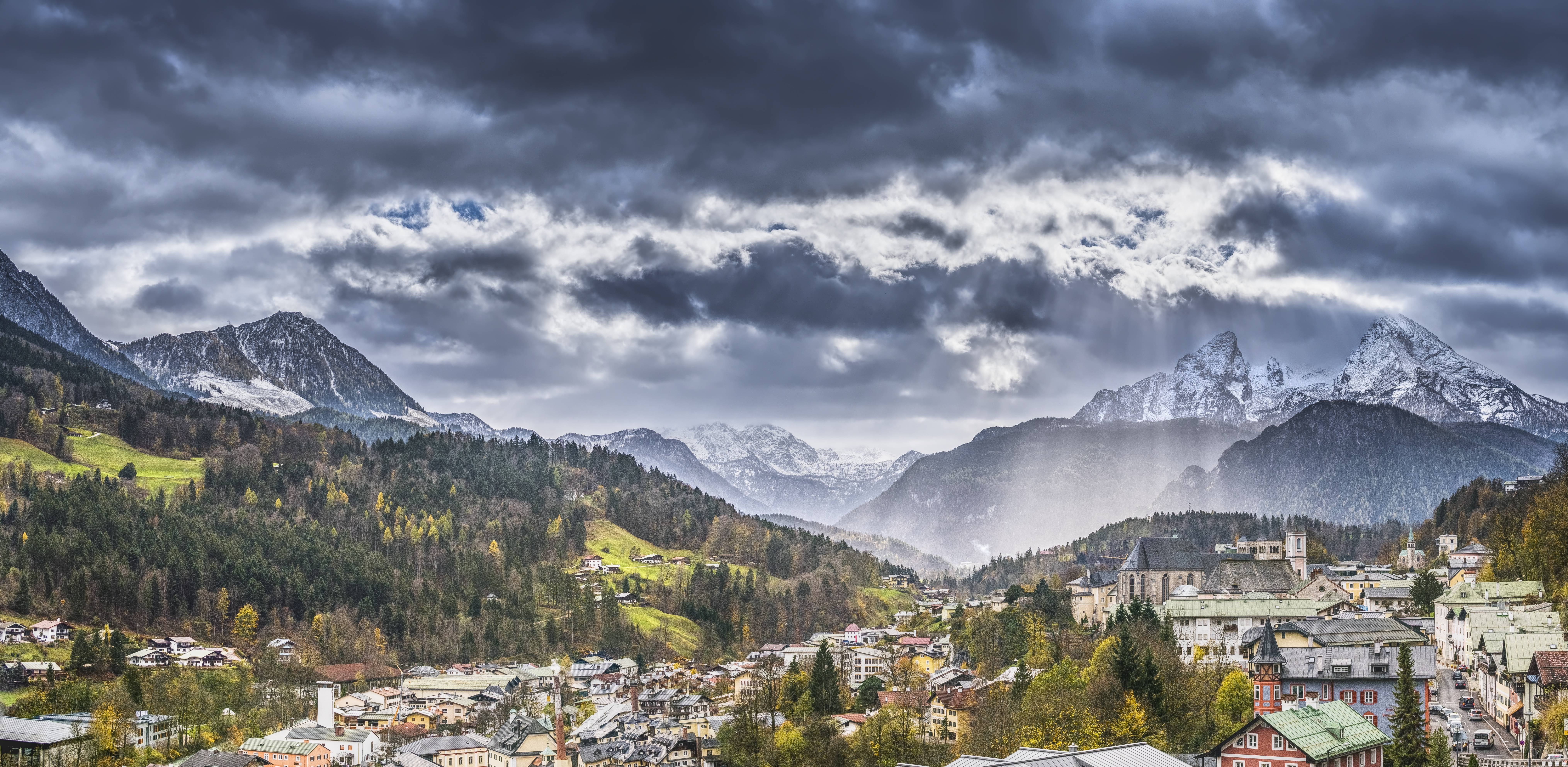 Berchtesgaden town nestled in the Bavarian Alps under stormy skies HD Wallpaper