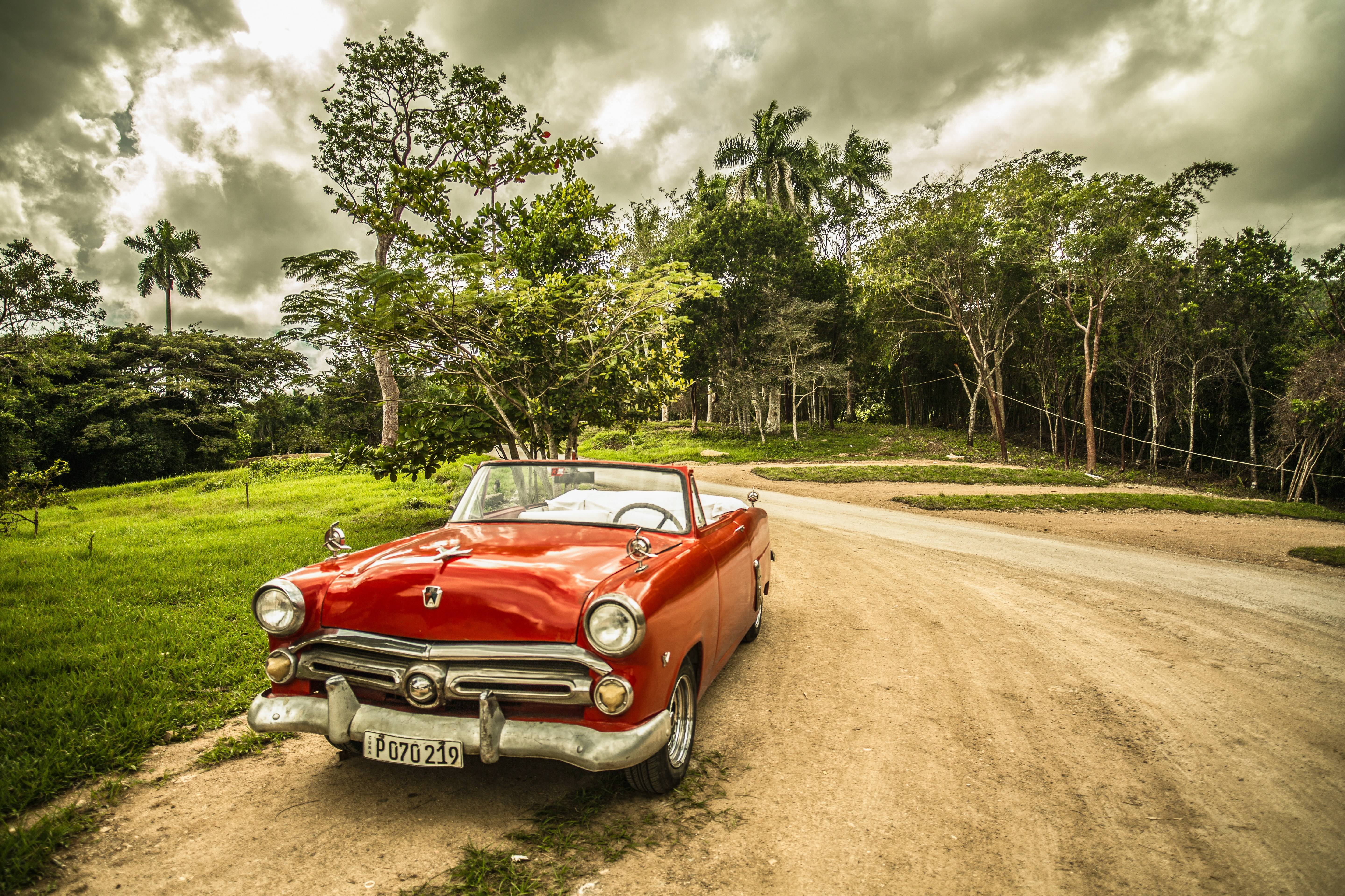 Red classic convertible car in Cuba HD Wallpaper