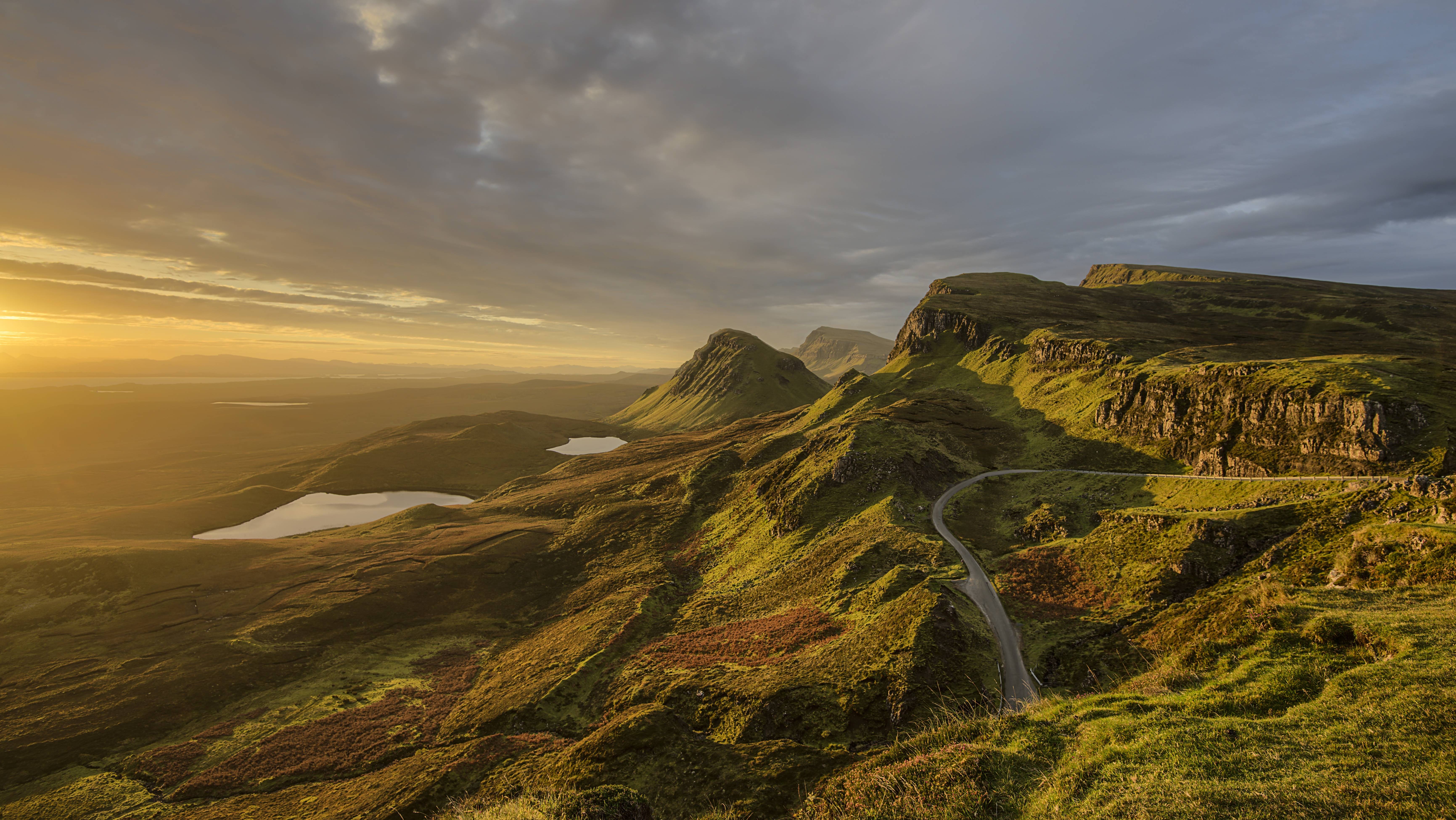 Winding road through hills at dawn HD Wallpaper