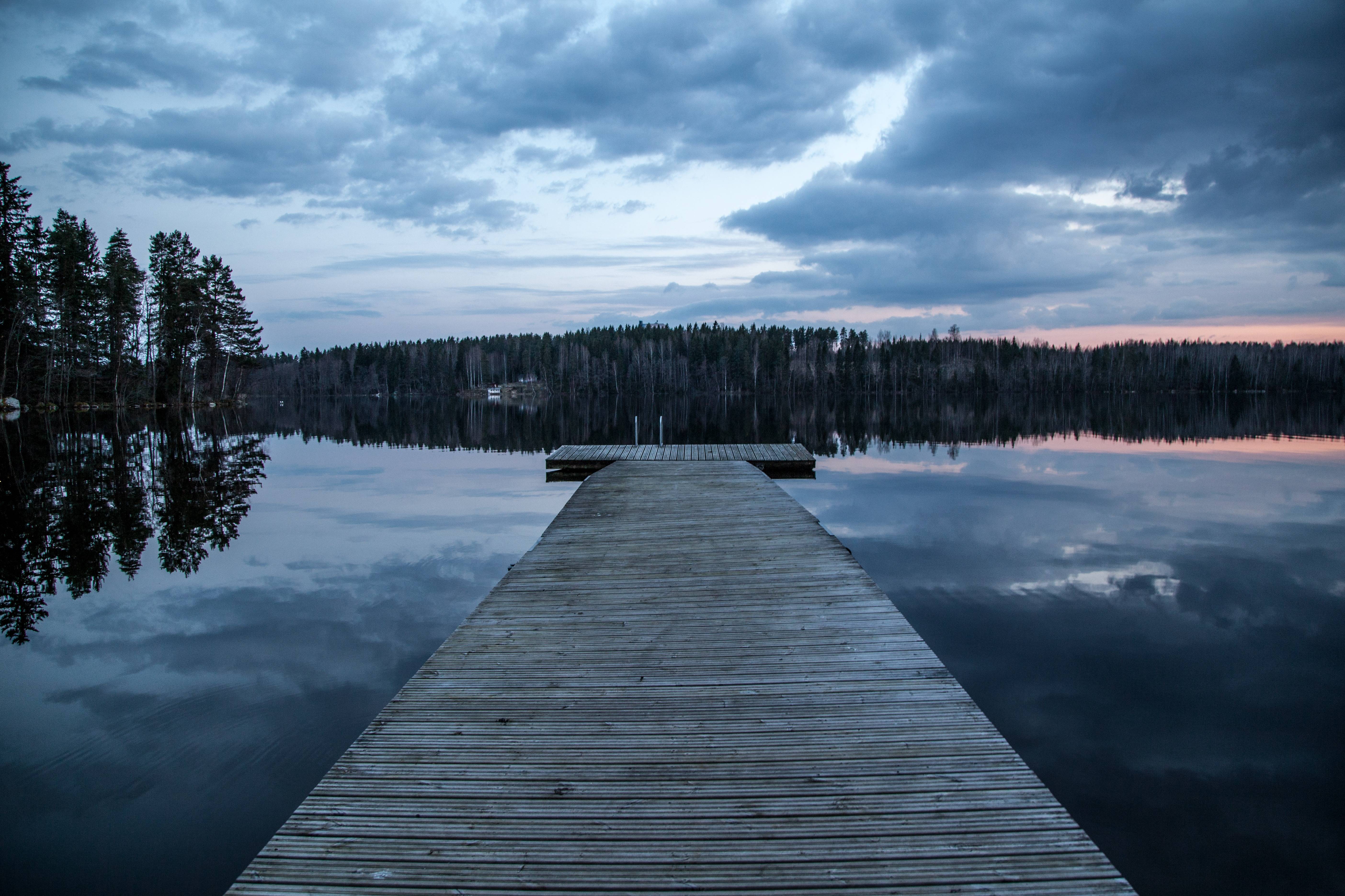 Wooden dock on a lake at dusk in Finland HD Wallpaper