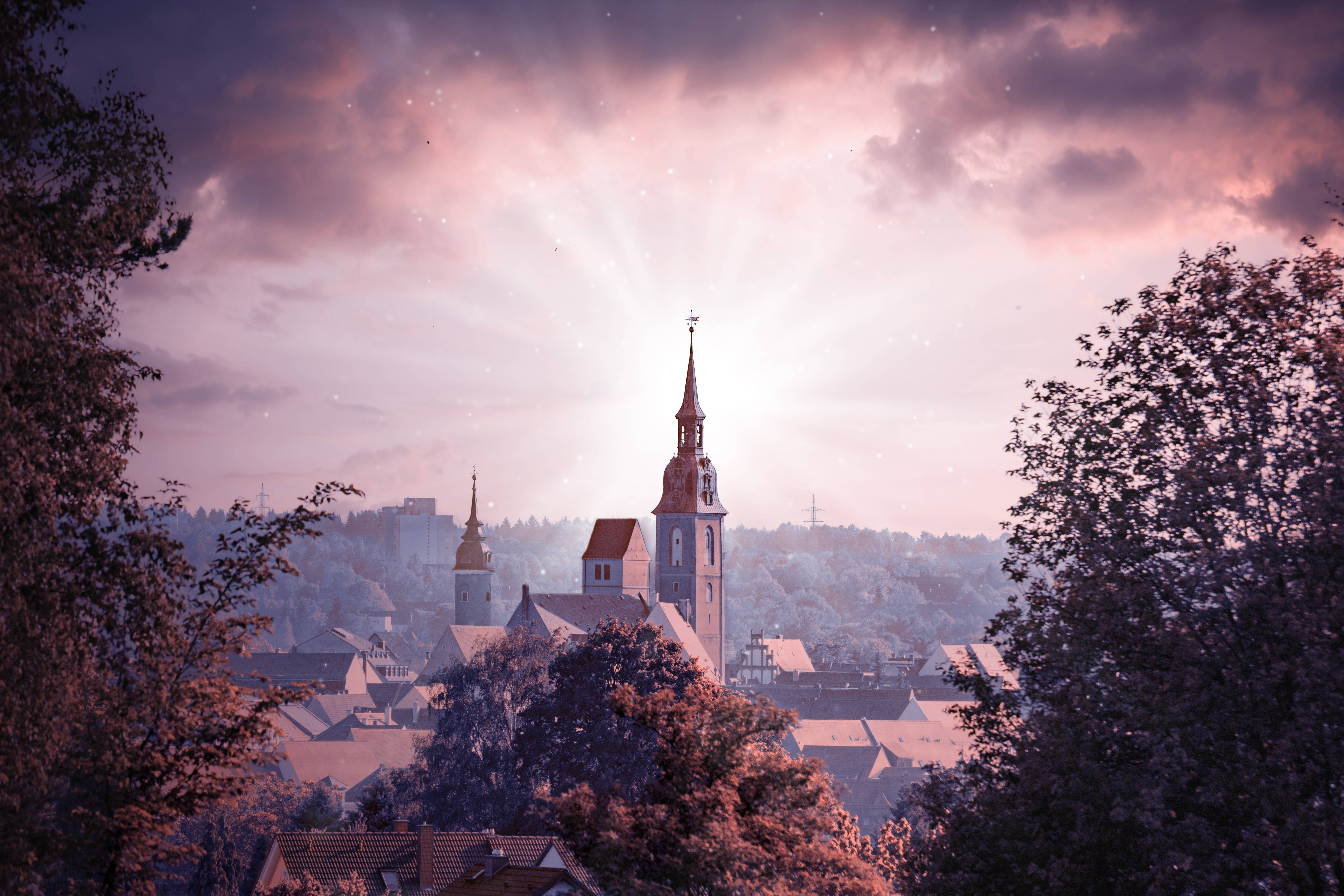 Church steeple in a historic European city HD Wallpaper