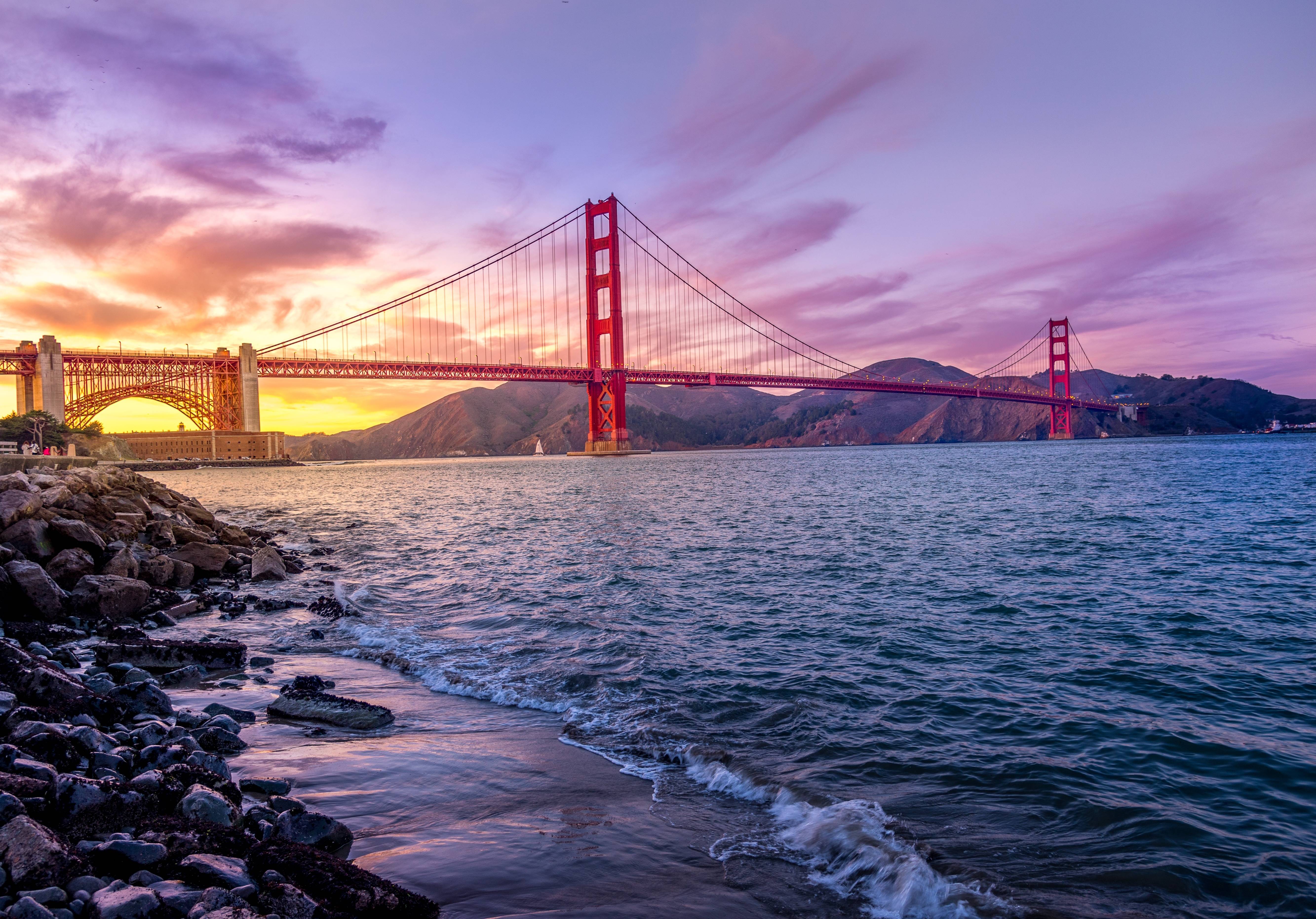 Golden Gate Bridge at sunset with purple sky HD Wallpaper