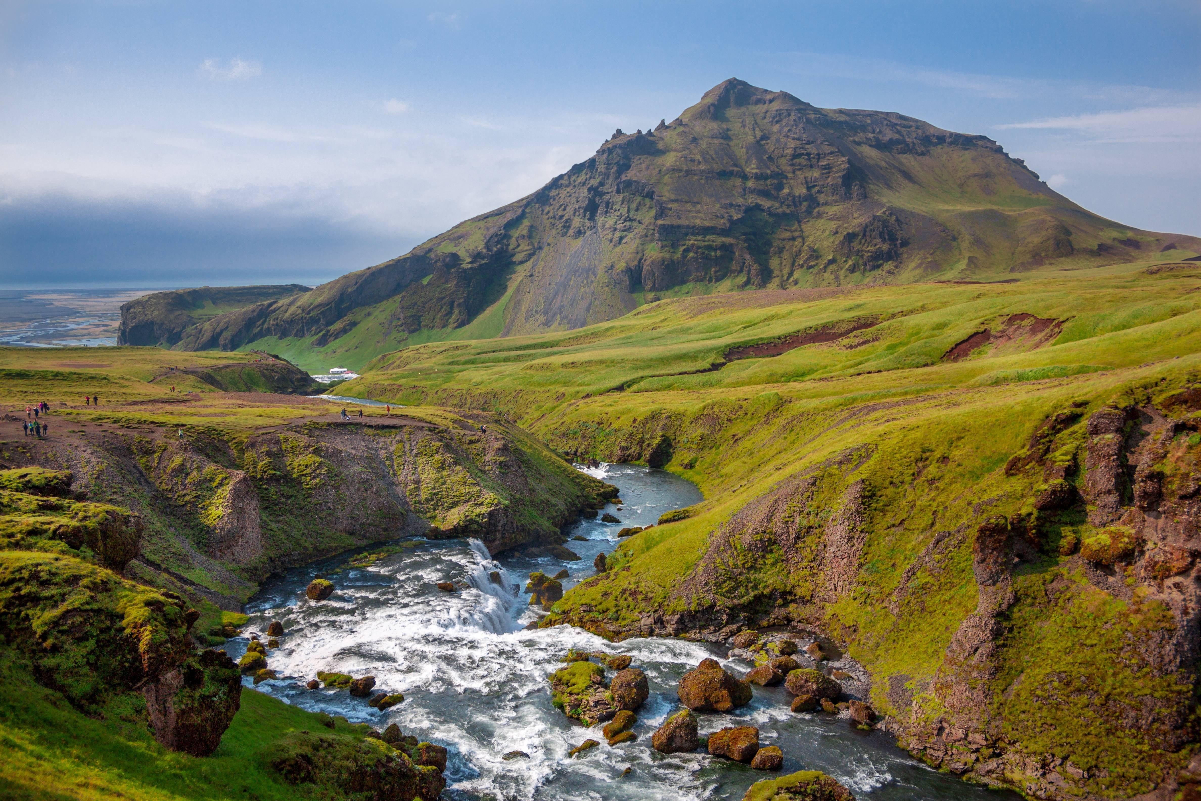 Mountain valley with a river and people HD Wallpaper