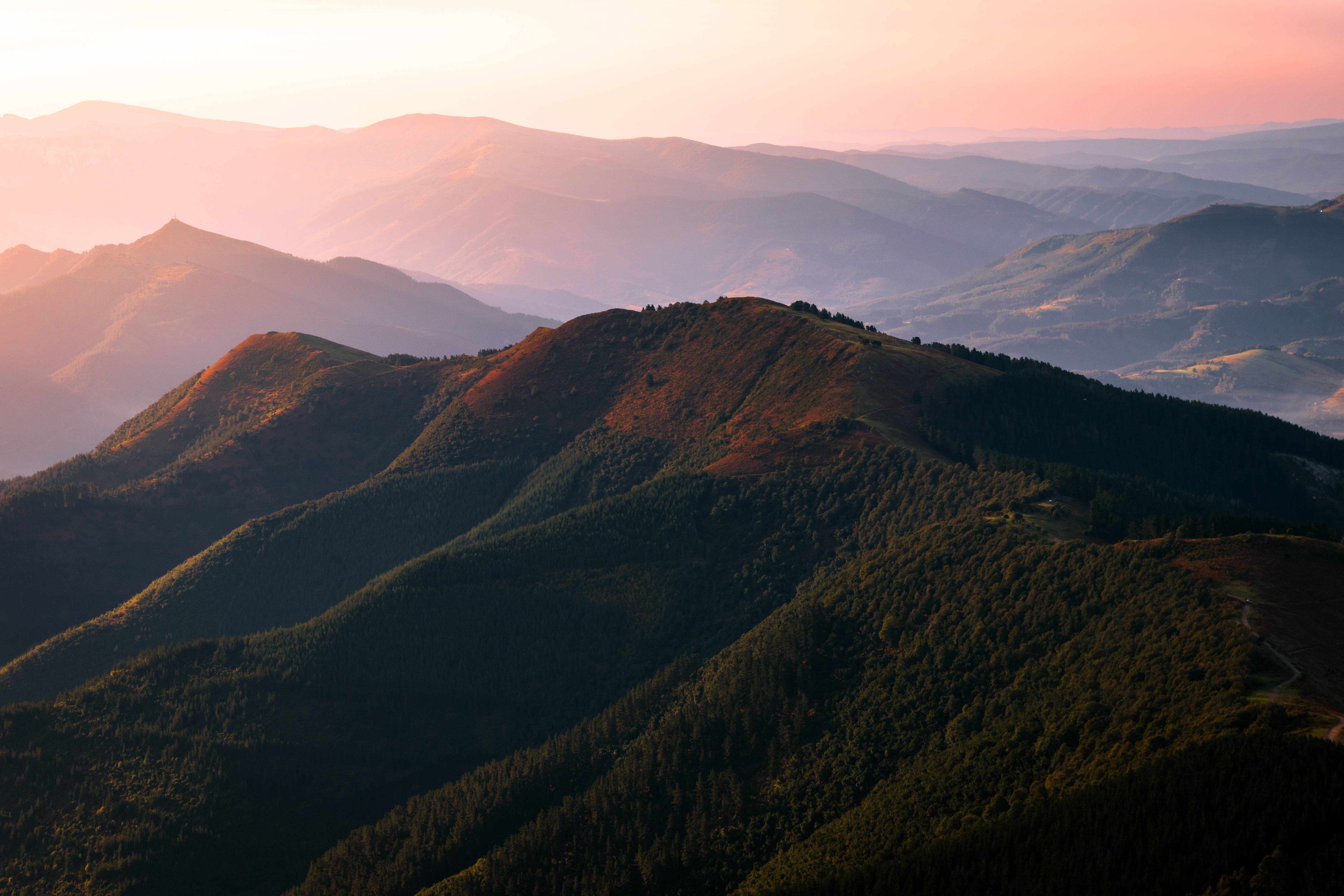 Mountain range at sunset with pink sky HD Wallpaper