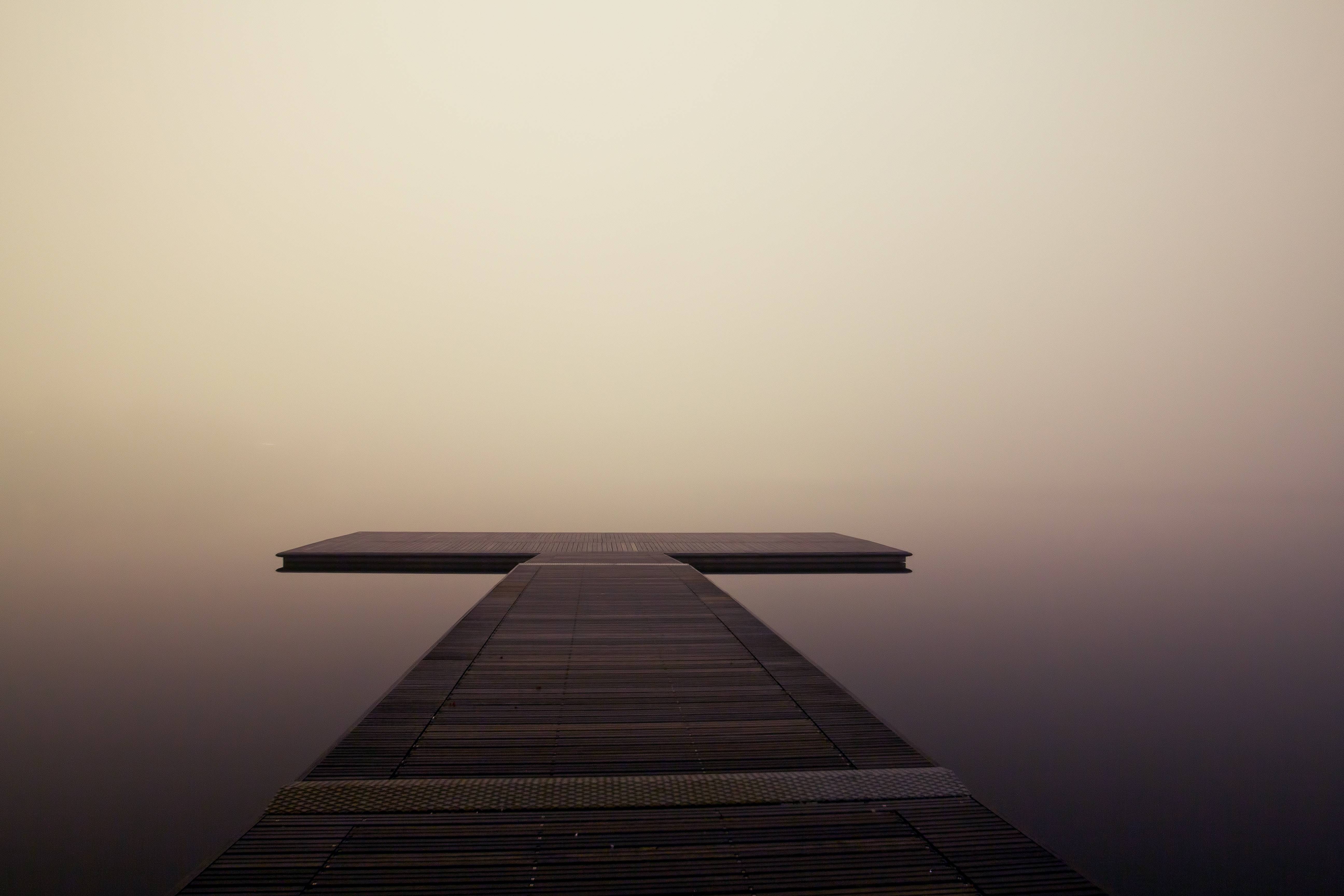 Wooden pier in the fog on a calm lake HD Wallpaper