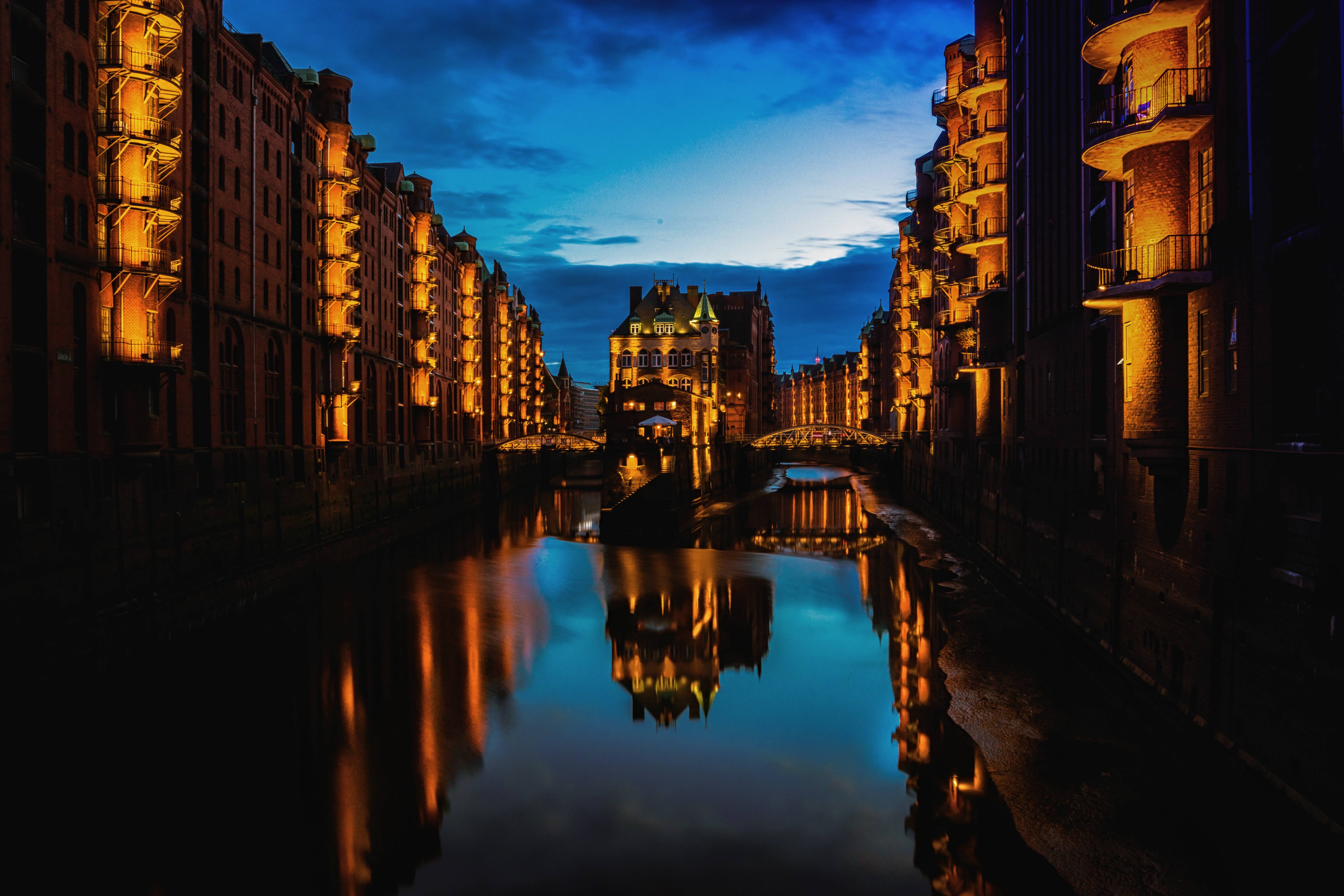 Hamburg Speicherstadt canal at night with reflections HD Wallpaper