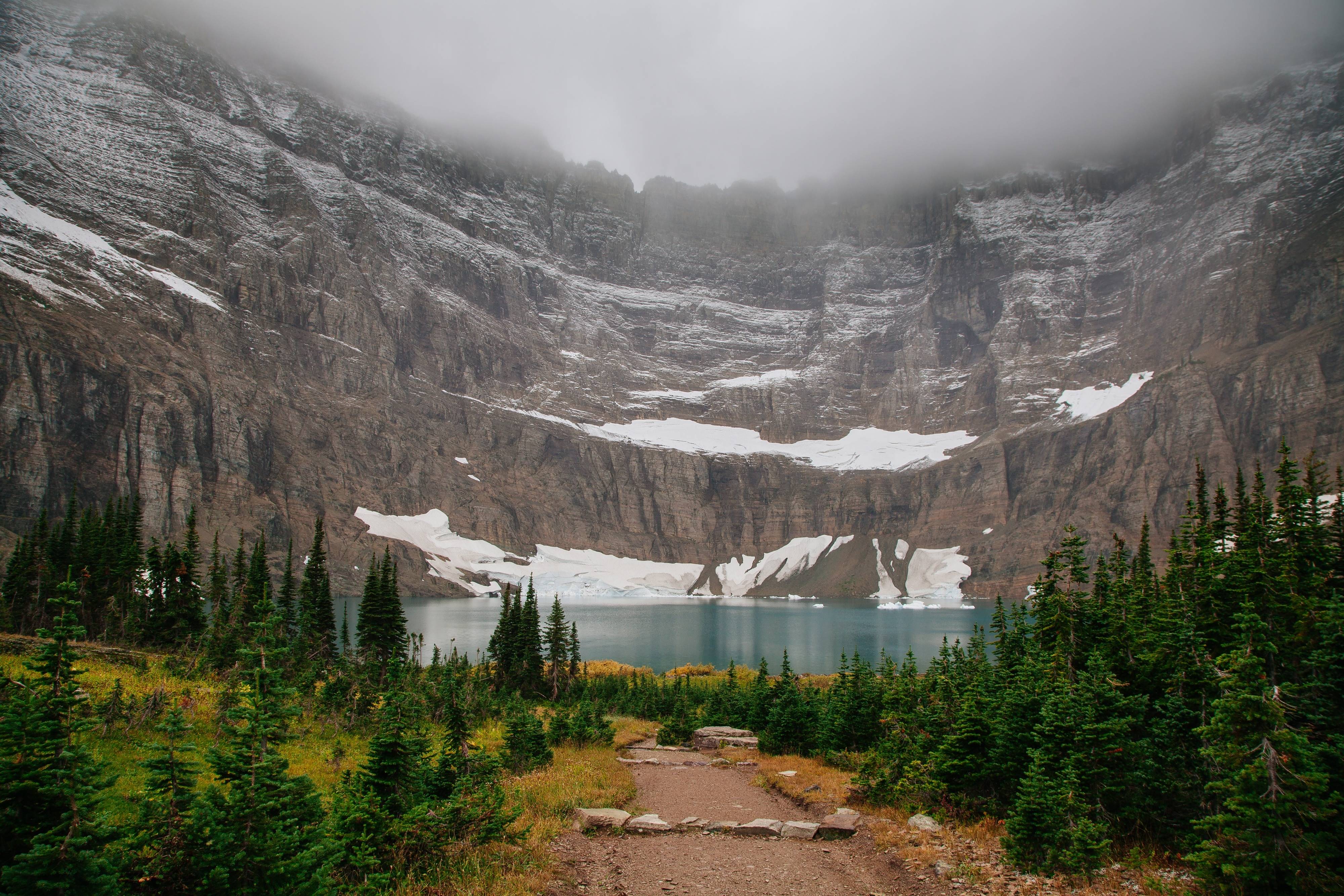 Foggy mountain lake with snow and pine trees HD Wallpaper