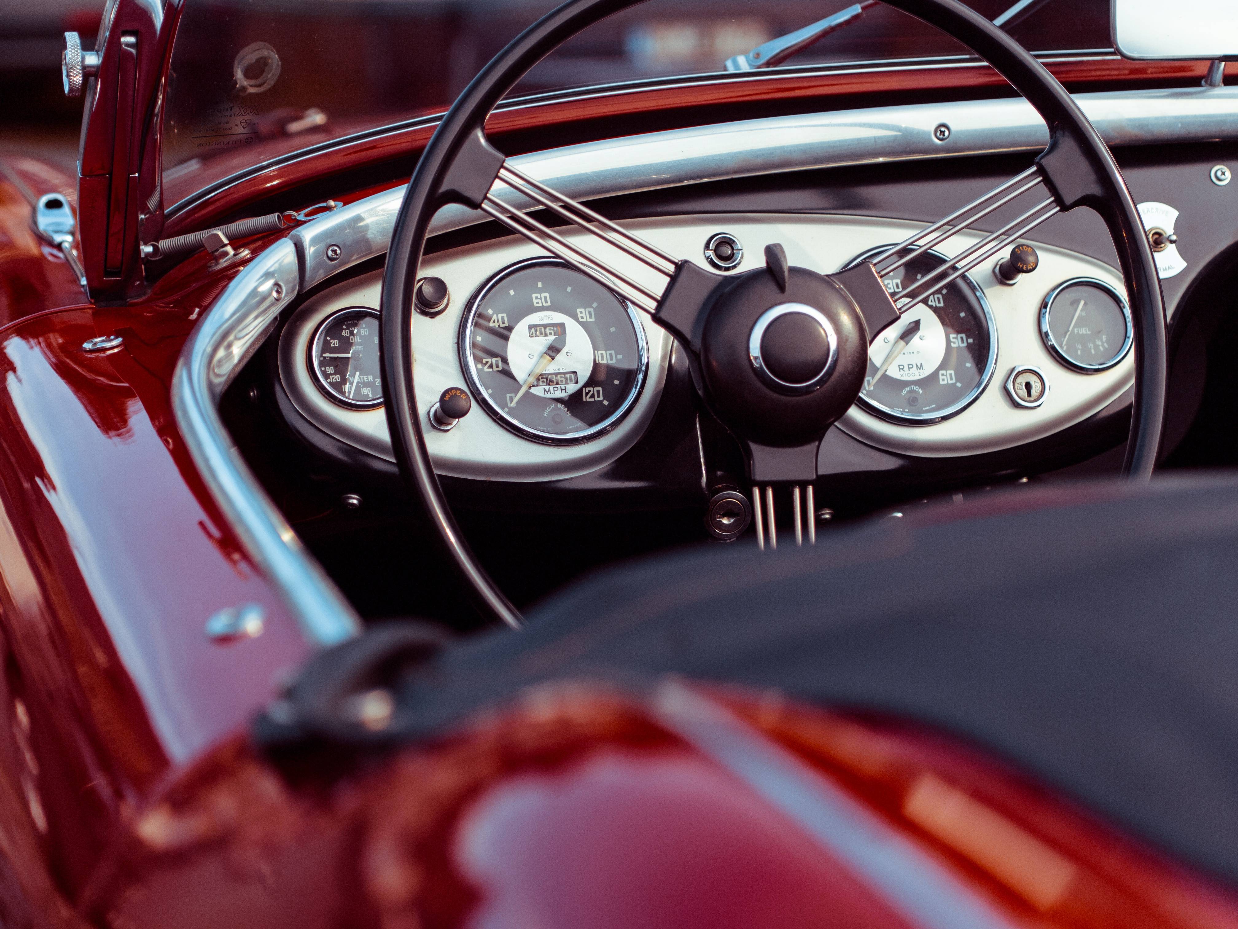 Close-up of a classic red convertible car dashboard HD Wallpaper