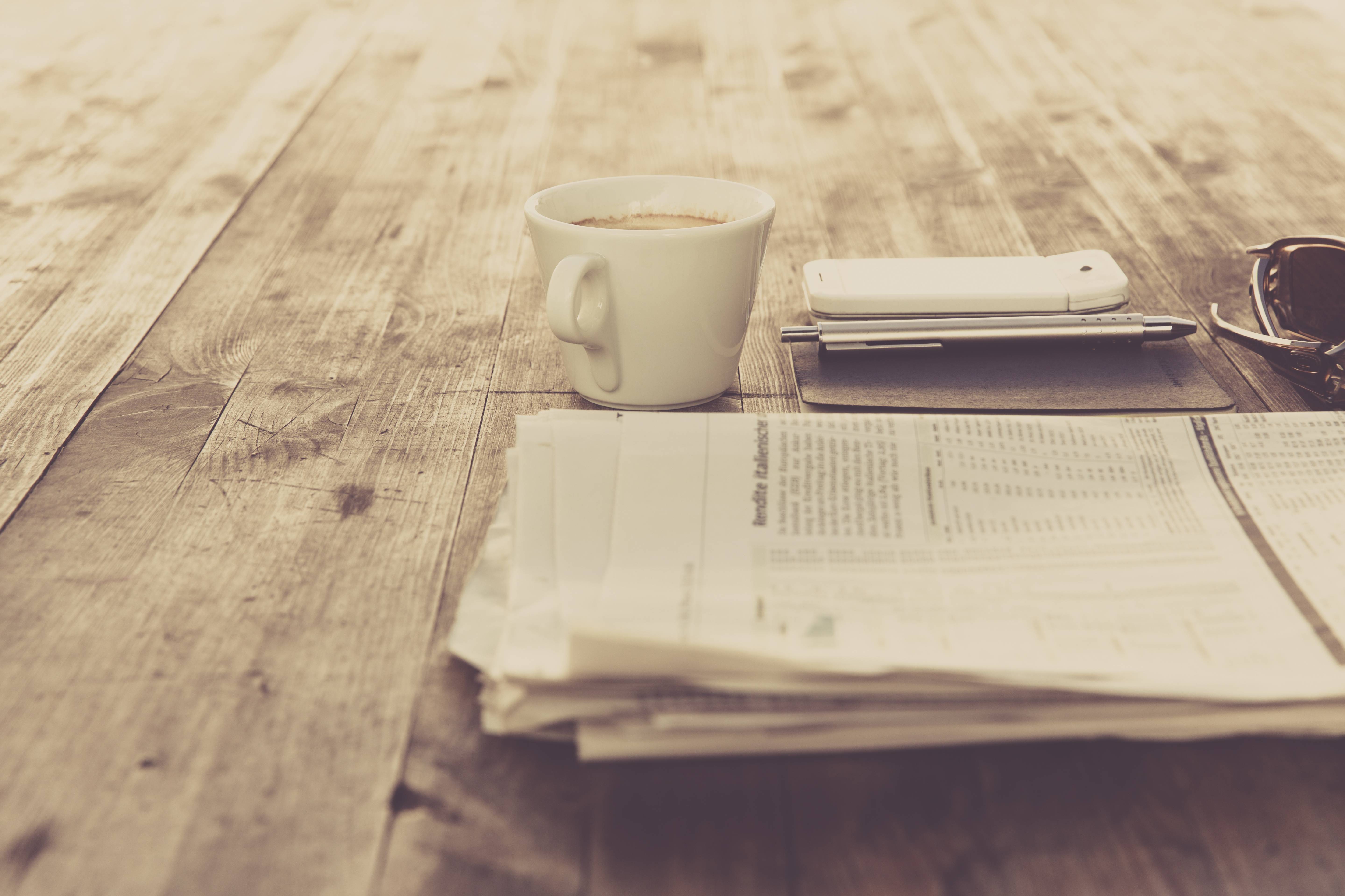 Coffee and newspaper on a wooden table HD Wallpaper