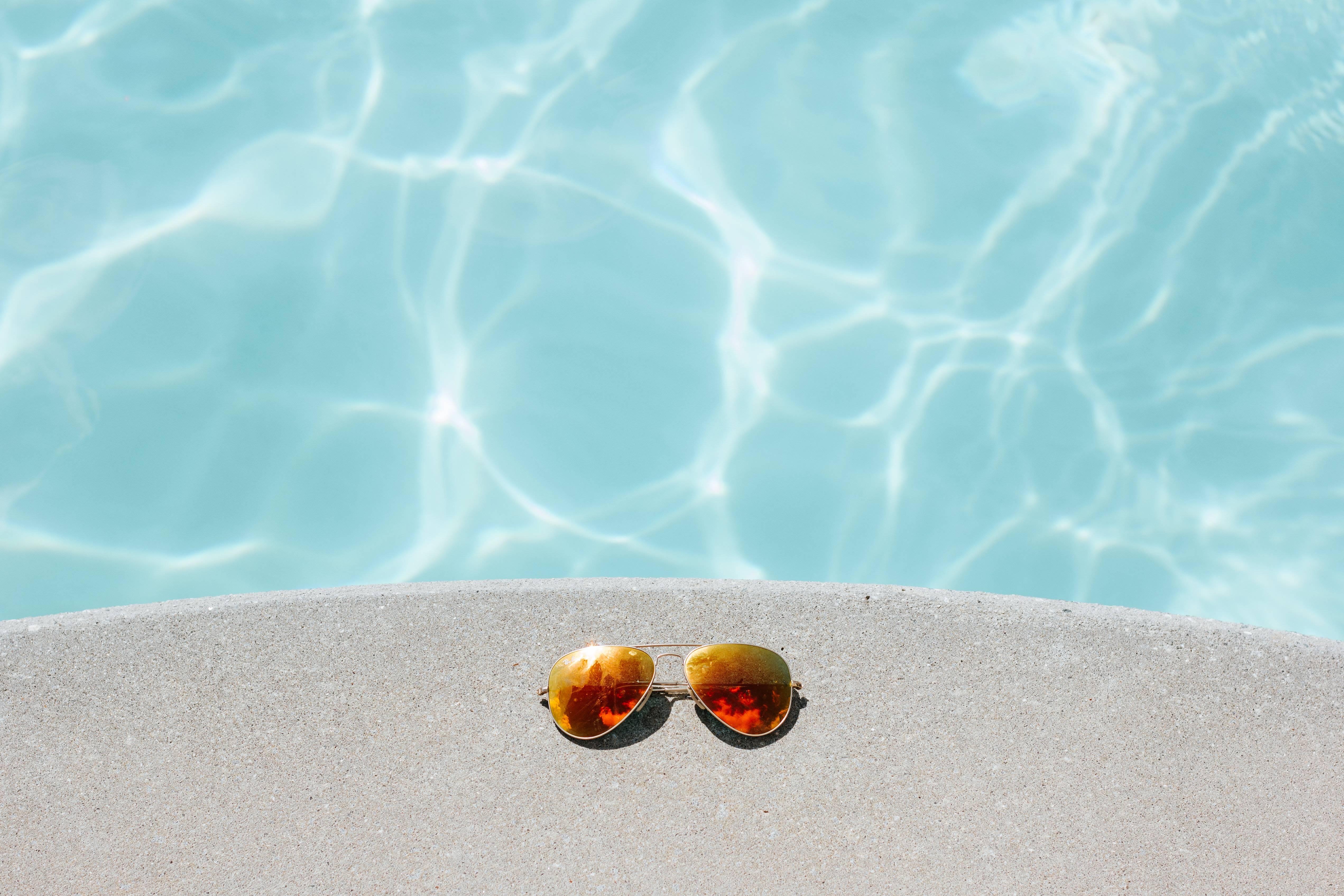 Sunglasses by the pool HD Wallpaper